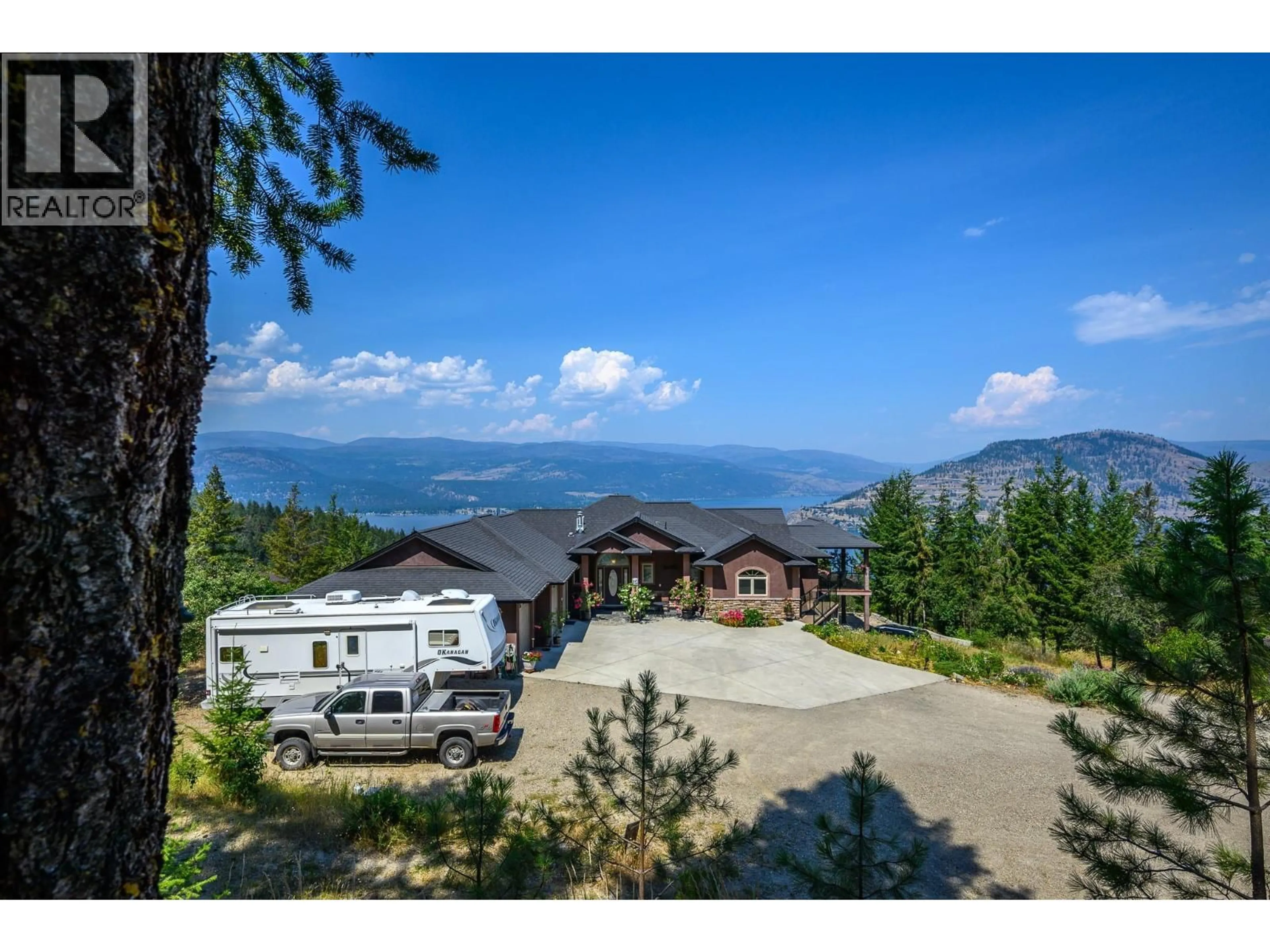 A pic from outside/outdoor area/front of a property/back of a property/a pic from drone, mountain view for 9265 KOKANEE ROAD, Vernon British Columbia V1H1K4