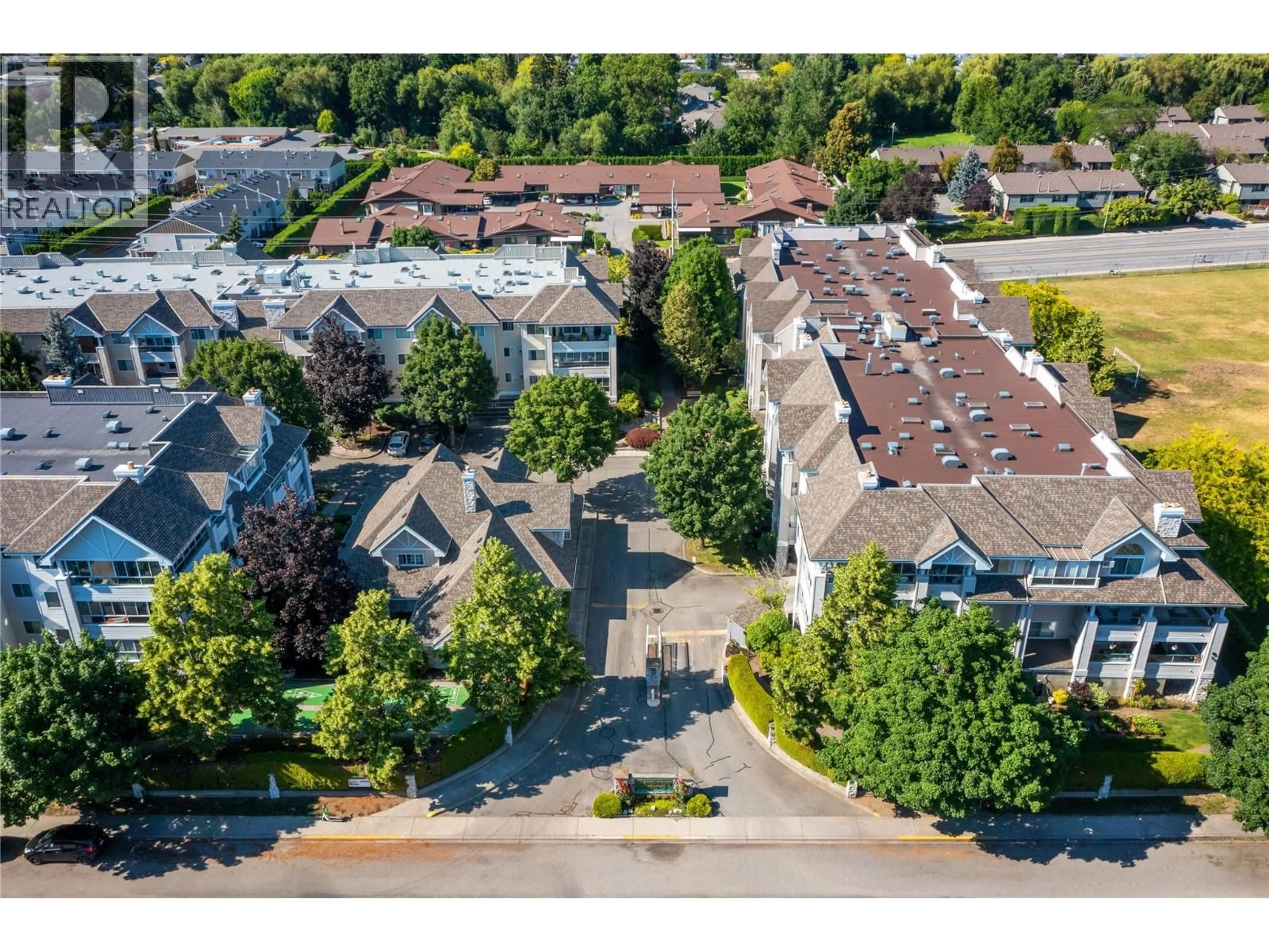 A pic from outside/outdoor area/front of a property/back of a property/a pic from drone, street for 304 - 980 GLENWOOD AVENUE, Kelowna British Columbia V1Y9P2