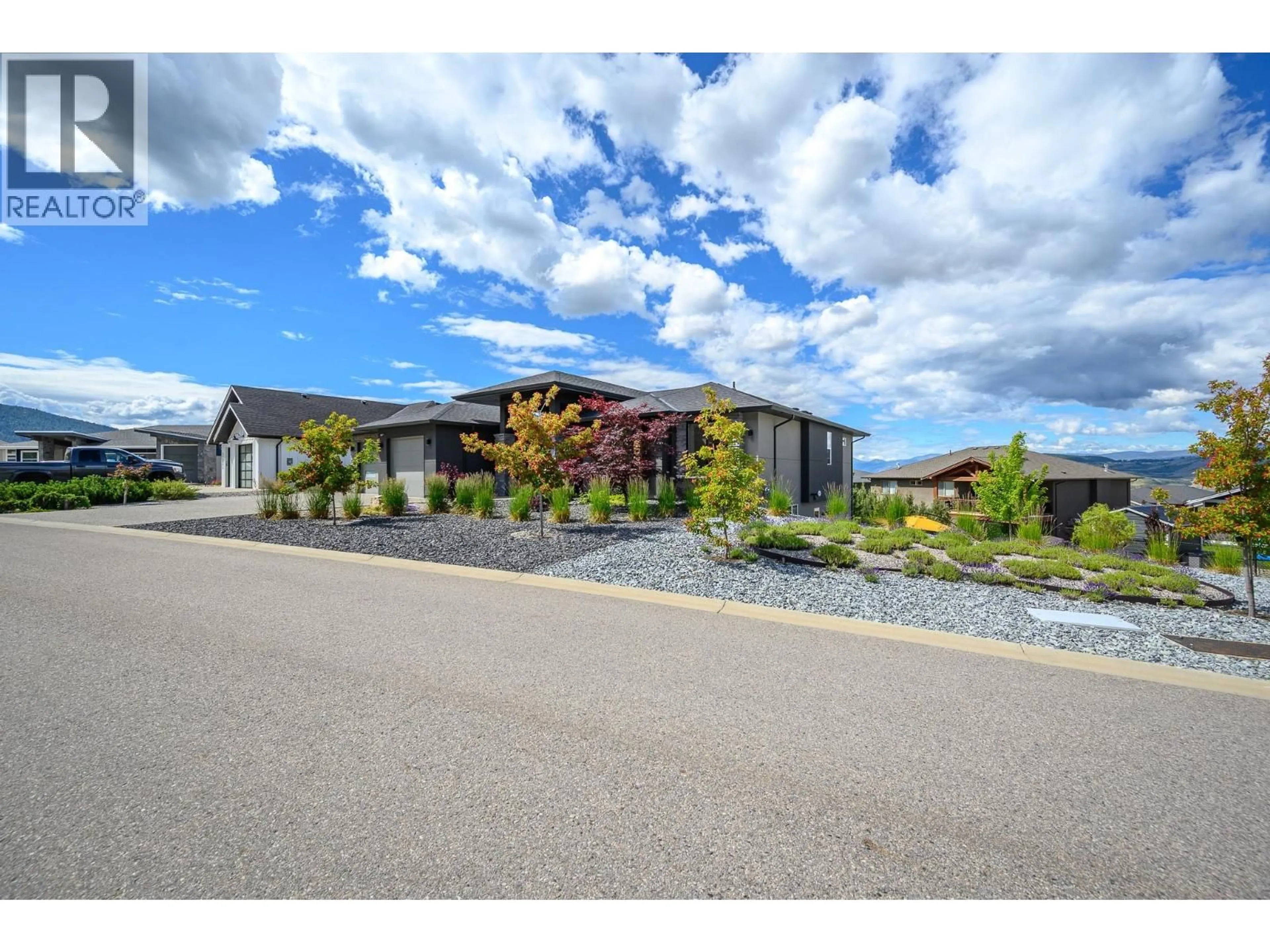 A pic from outside/outdoor area/front of a property/back of a property/a pic from drone, street for 306 BALDY PLACE, Vernon British Columbia V1B0A3