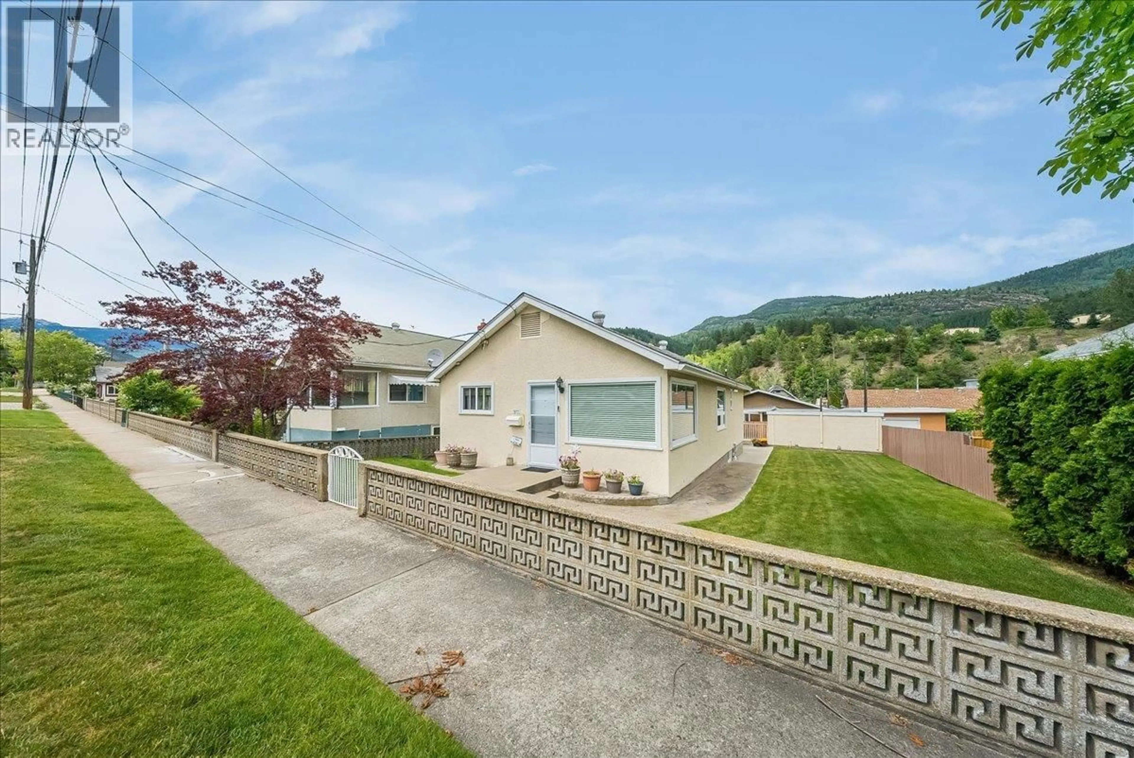A pic from outside/outdoor area/front of a property/back of a property/a pic from drone, mountain view for 1817 FOURTH AVENUE, Trail British Columbia V1R1T2