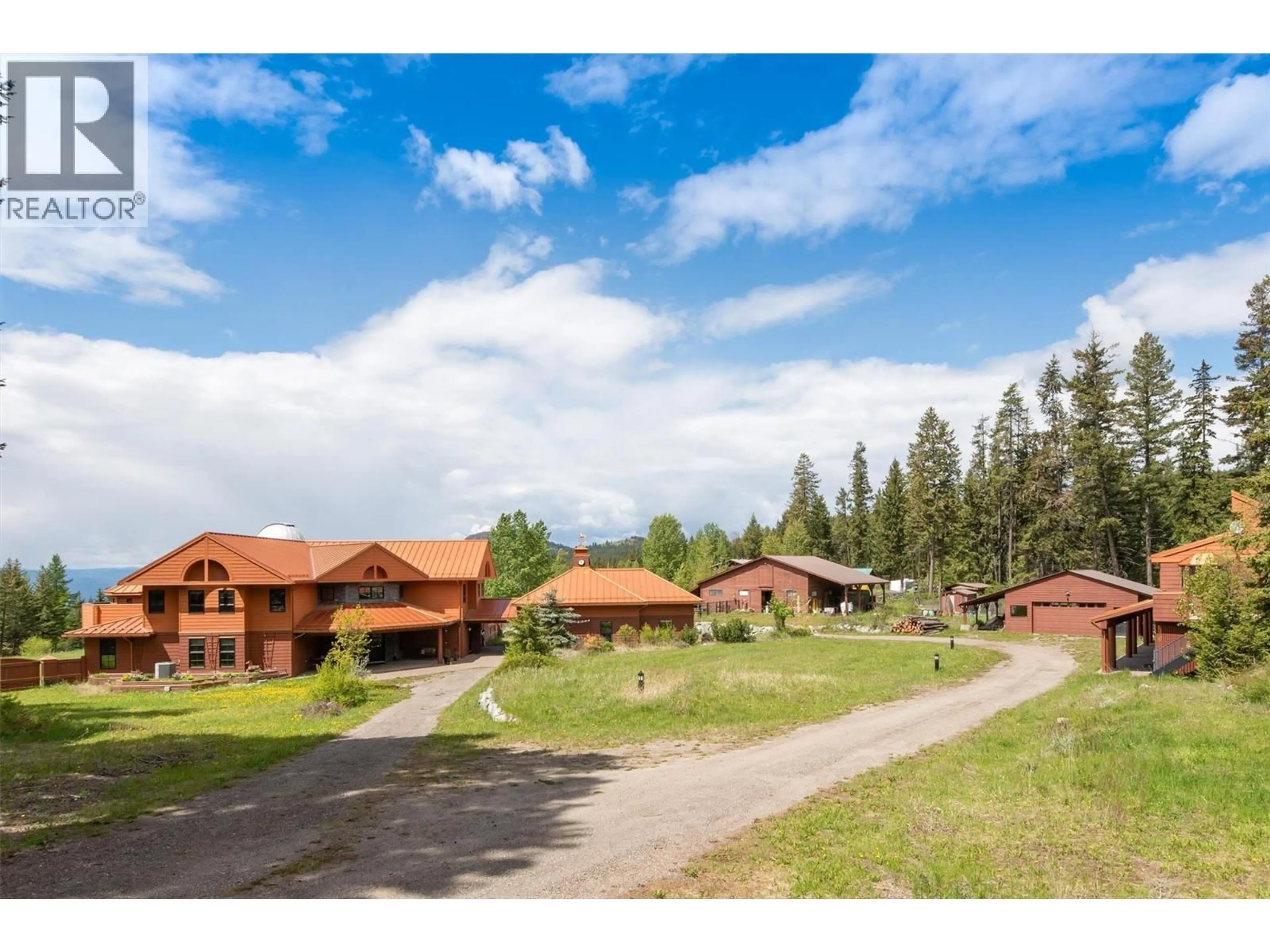 A pic from outside/outdoor area/front of a property/back of a property/a pic from drone, mountain view for 1306 HUCKLEBERRY ROAD, Kelowna British Columbia V1P1M5