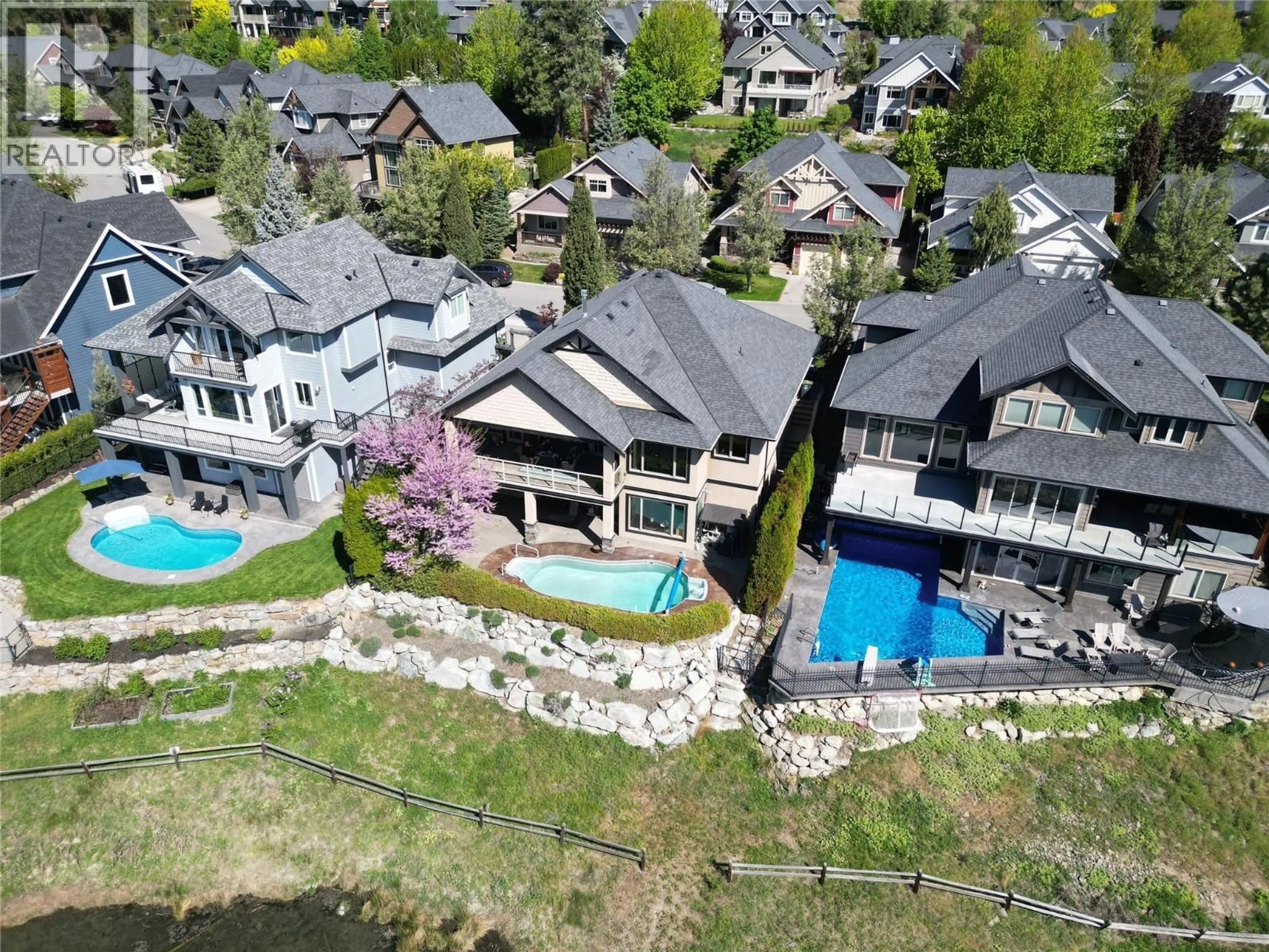 A pic from outside/outdoor area/front of a property/back of a property/a pic from drone, water/lake/river/ocean view for 1902 HIDDEN LAKE PLACE, Kelowna British Columbia V1V2W8