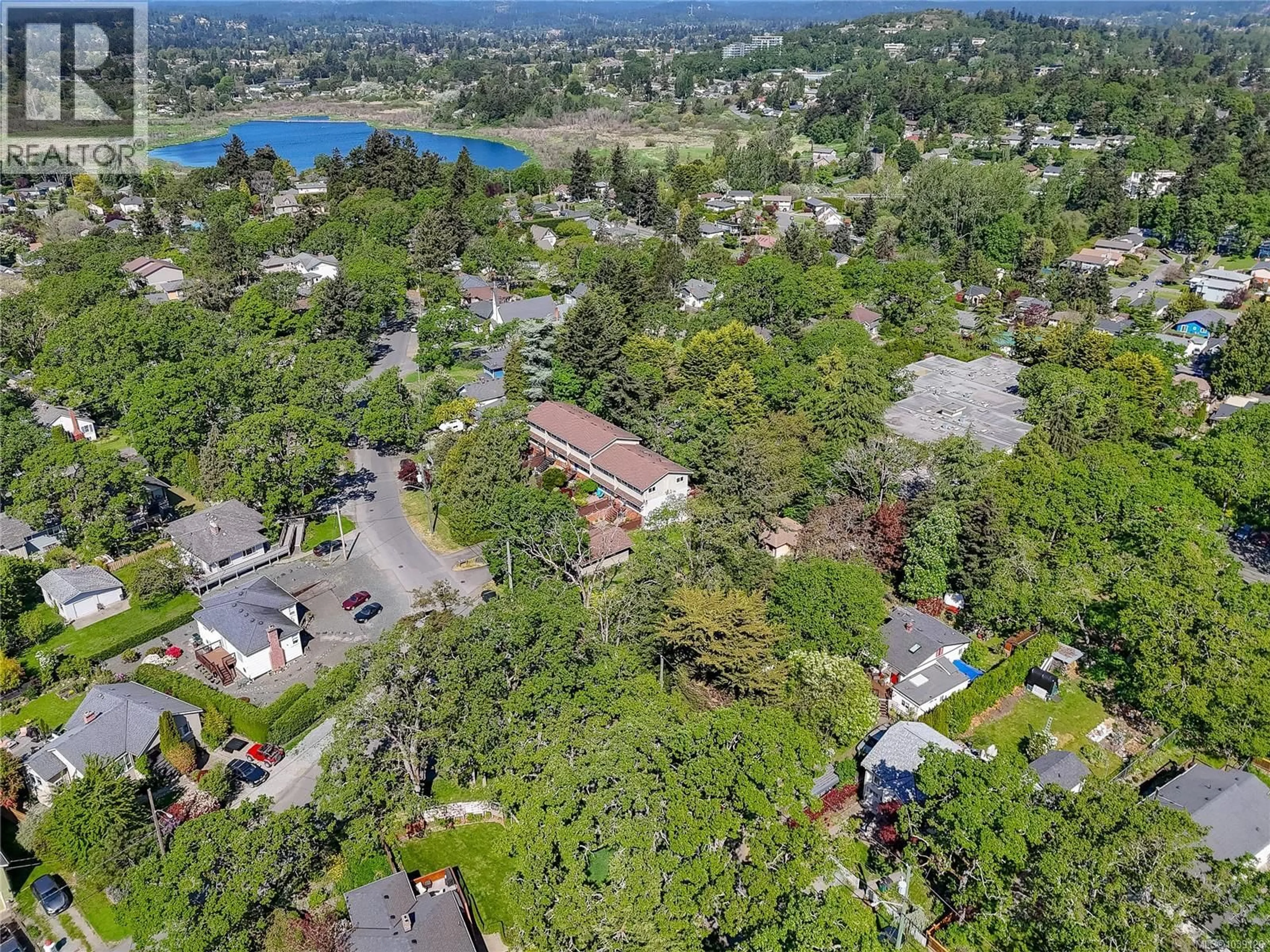 A pic from outside/outdoor area/front of a property/back of a property/a pic from drone, mountain view for 1022 FALMOUTH ROAD, Saanich British Columbia V8X3A5