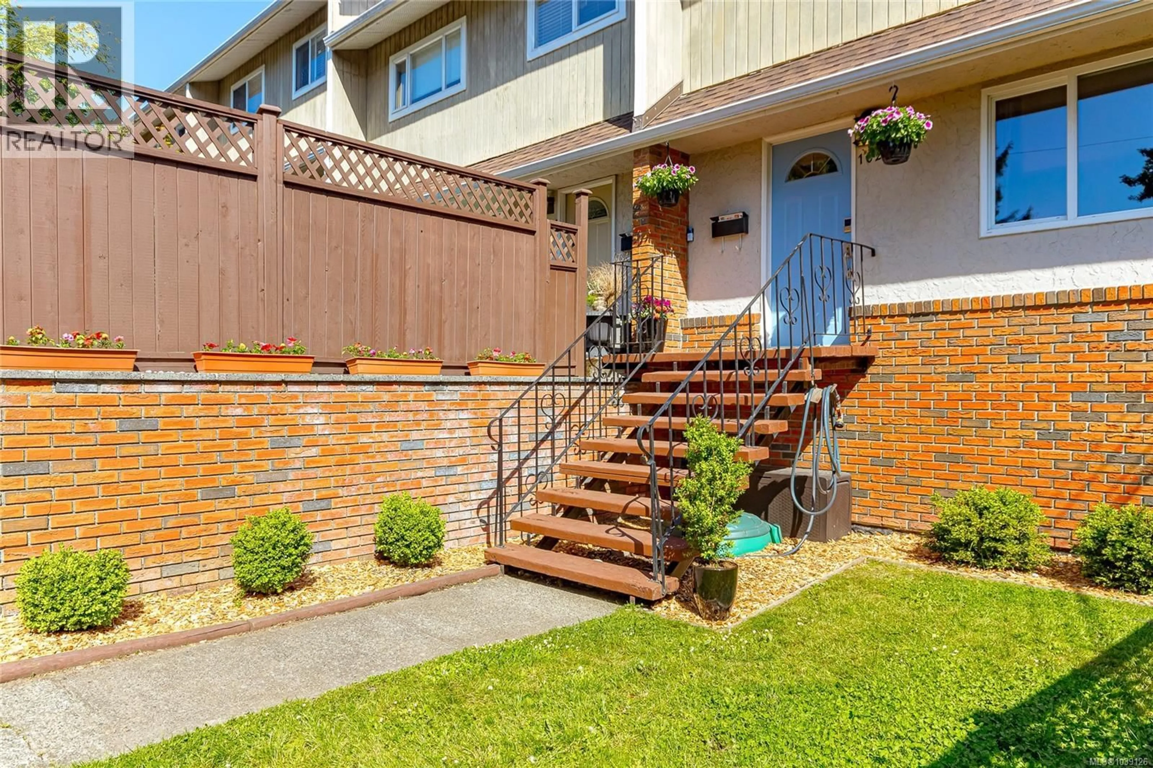 Home with brick exterior material, street for 1022 FALMOUTH ROAD, Saanich British Columbia V8X3A5