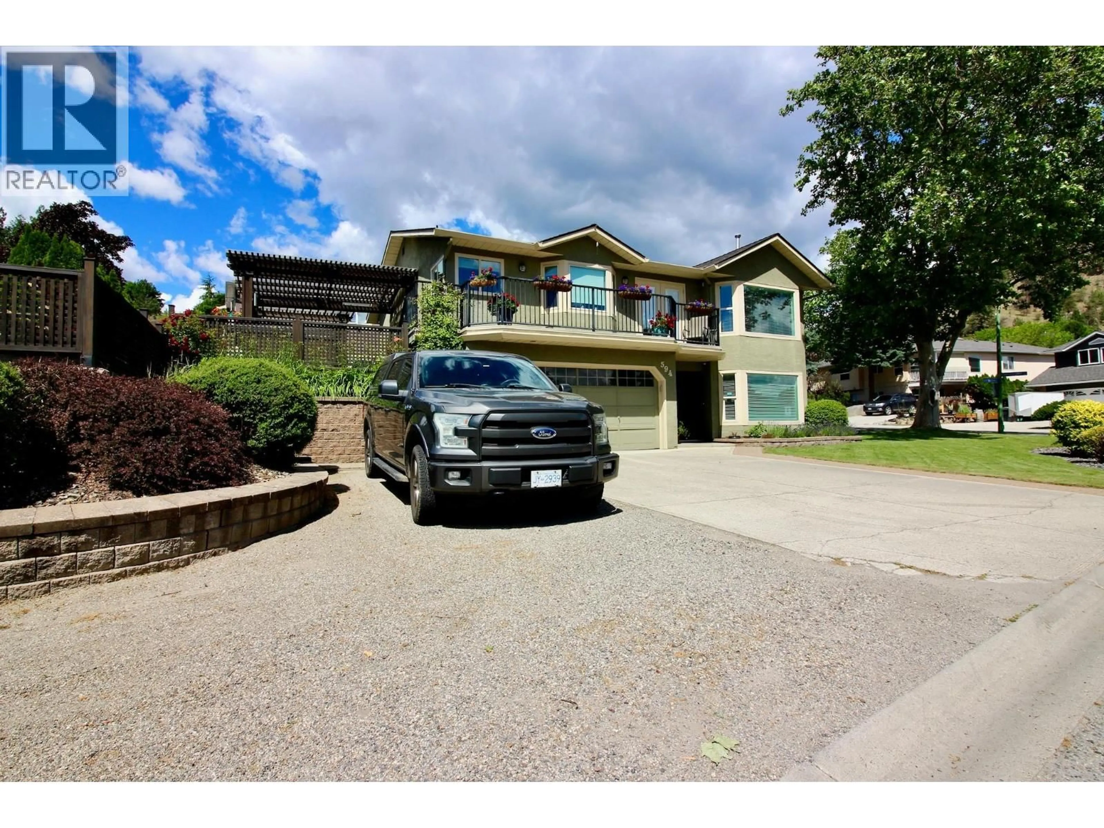 A pic from outside/outdoor area/front of a property/back of a property/a pic from drone, street for 594 GLENMEADOWS ROAD, Kelowna British Columbia V1V1P3
