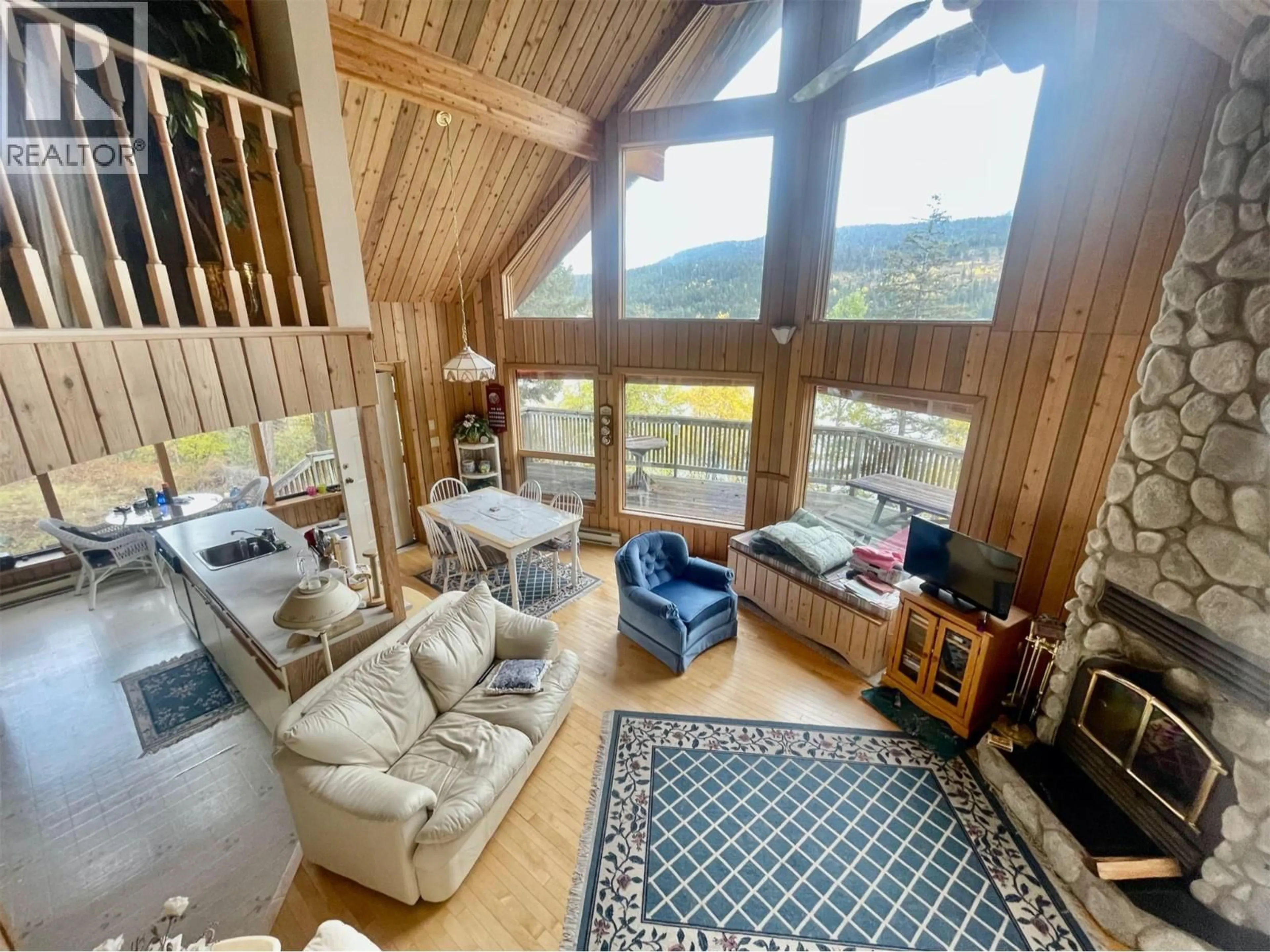 Living room with furniture, wood/laminate floor for 2800 GUN LAKE ROAD WEST, Gold Bridge British Columbia V0K1P0
