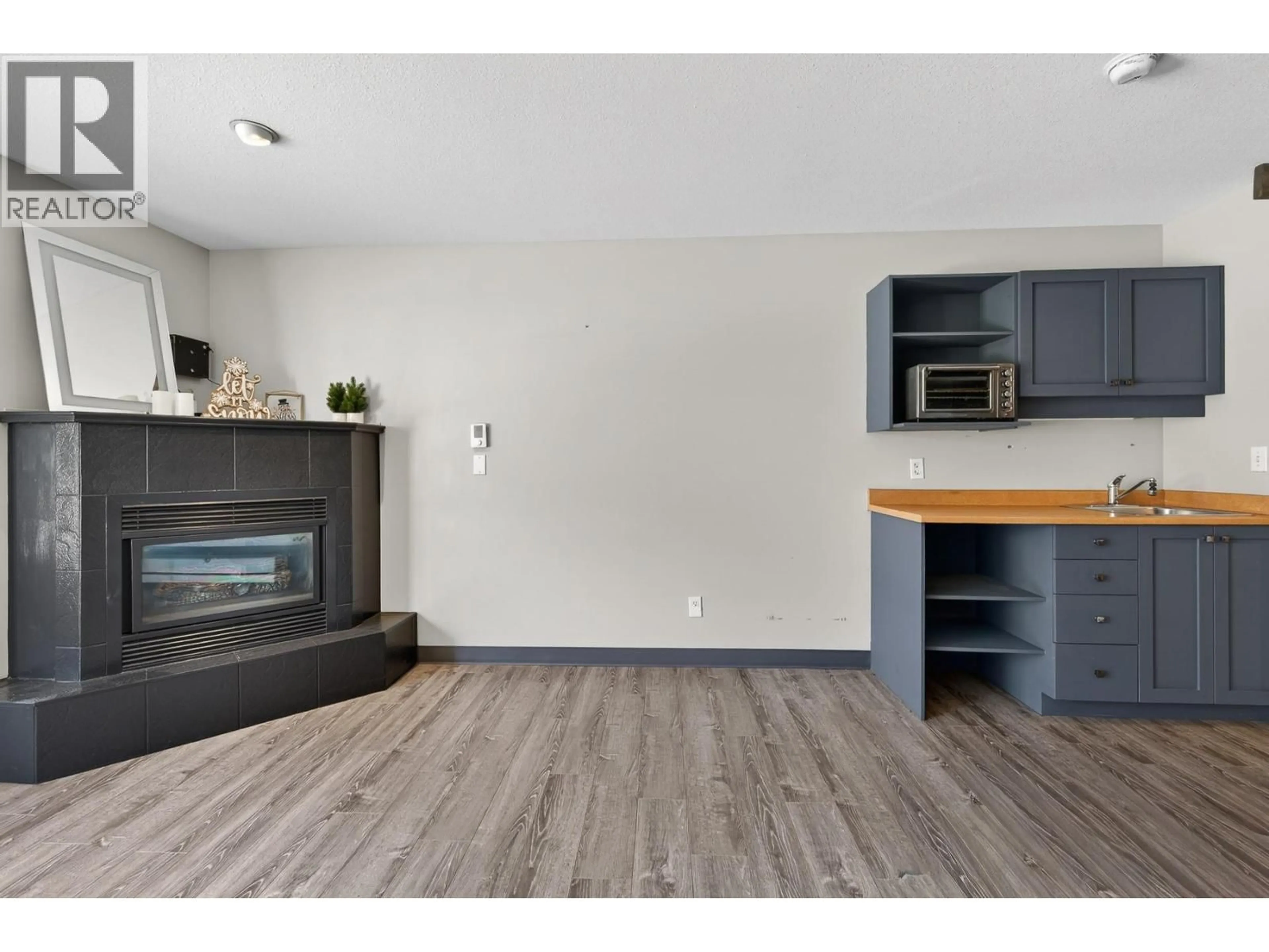 Open concept kitchen, wood/laminate floor for 335 - 5340 BIG WHITE ROAD, Big White British Columbia V1P1P3