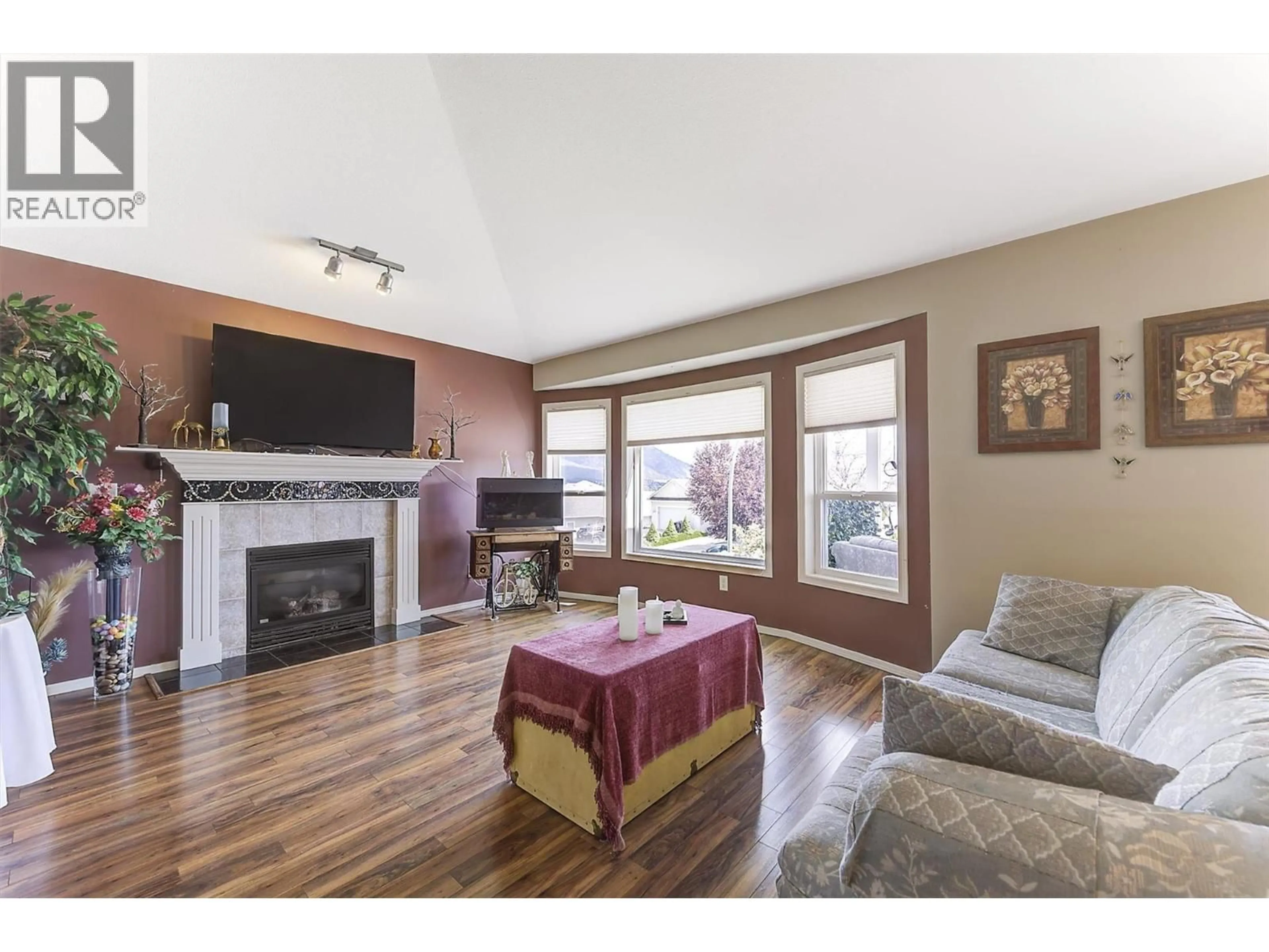 Living room with furniture, wood/laminate floor for 3684 MORNINGSIDE DRIVE, West Kelowna British Columbia V4T2T8