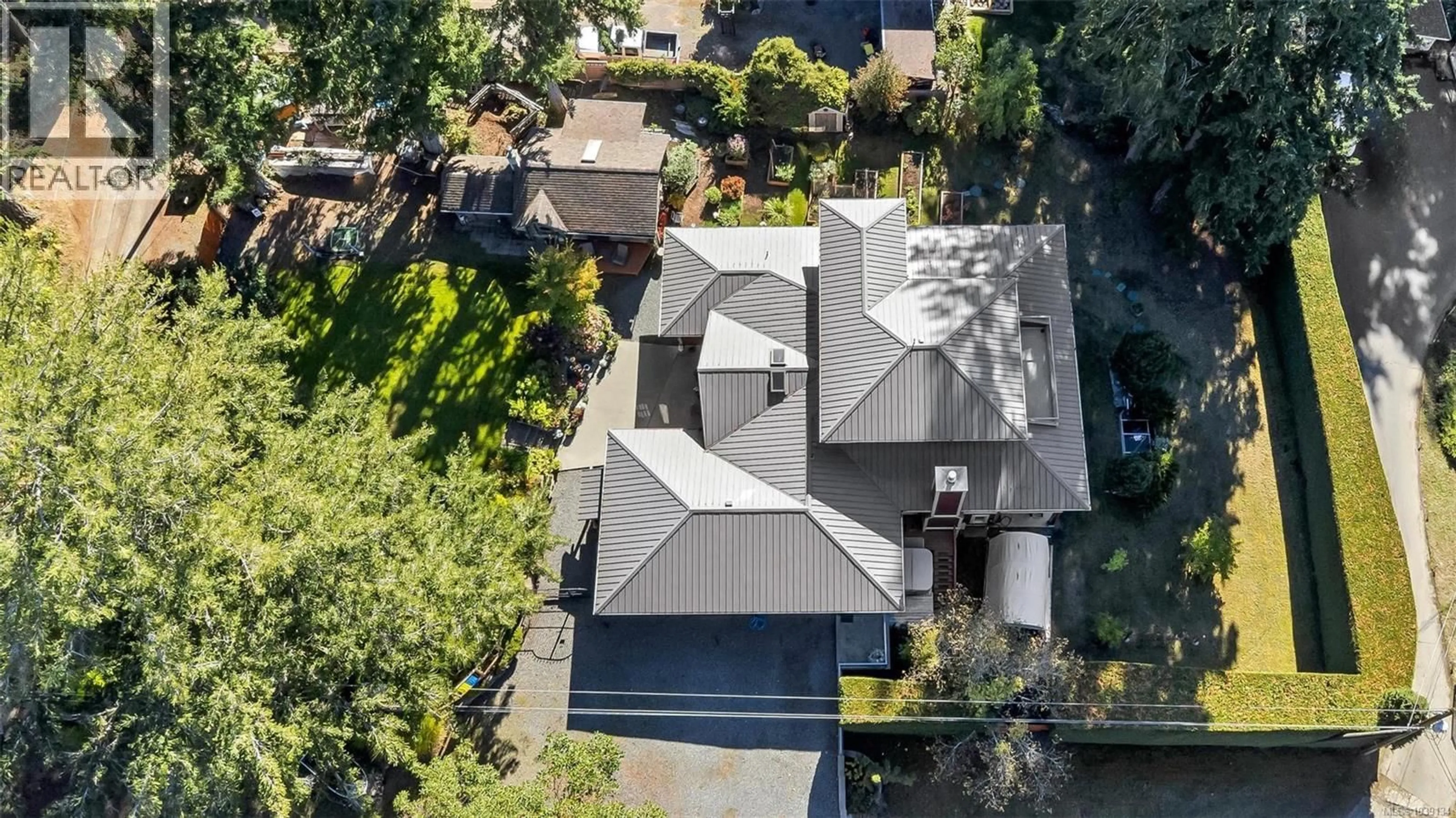 A pic from outside/outdoor area/front of a property/back of a property/a pic from drone, street for 1870 MUNSIE ROAD, Shawnigan Lake British Columbia V8H2A8