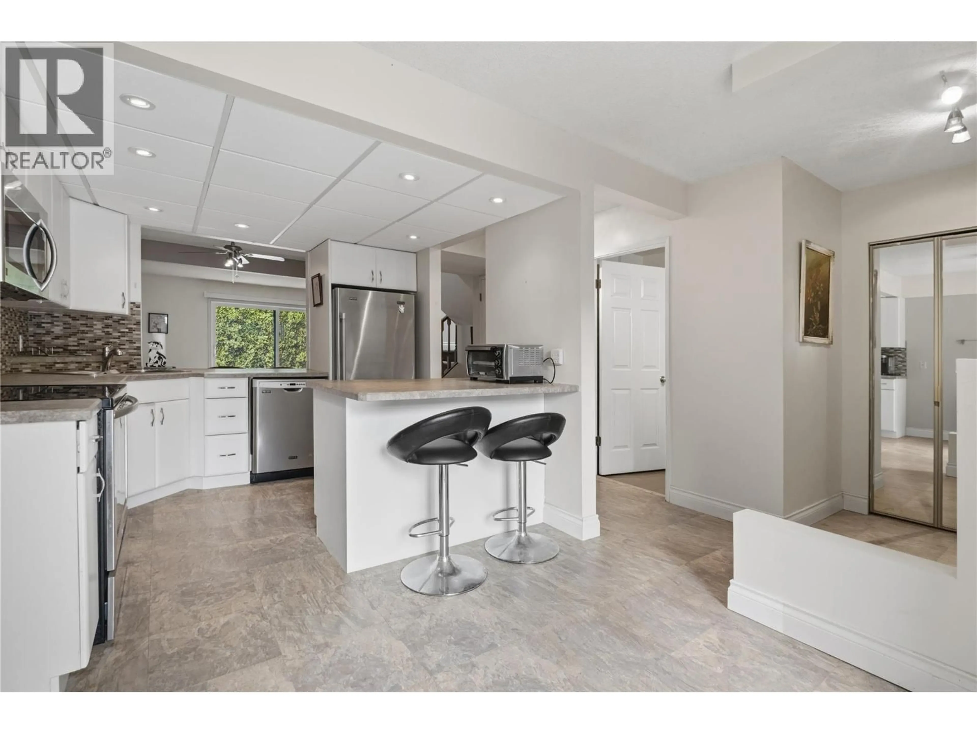 Open concept kitchen, ceramic/tile floor for 115 - 1050 SPRINGFIELD ROAD, Kelowna British Columbia V1Y8J7