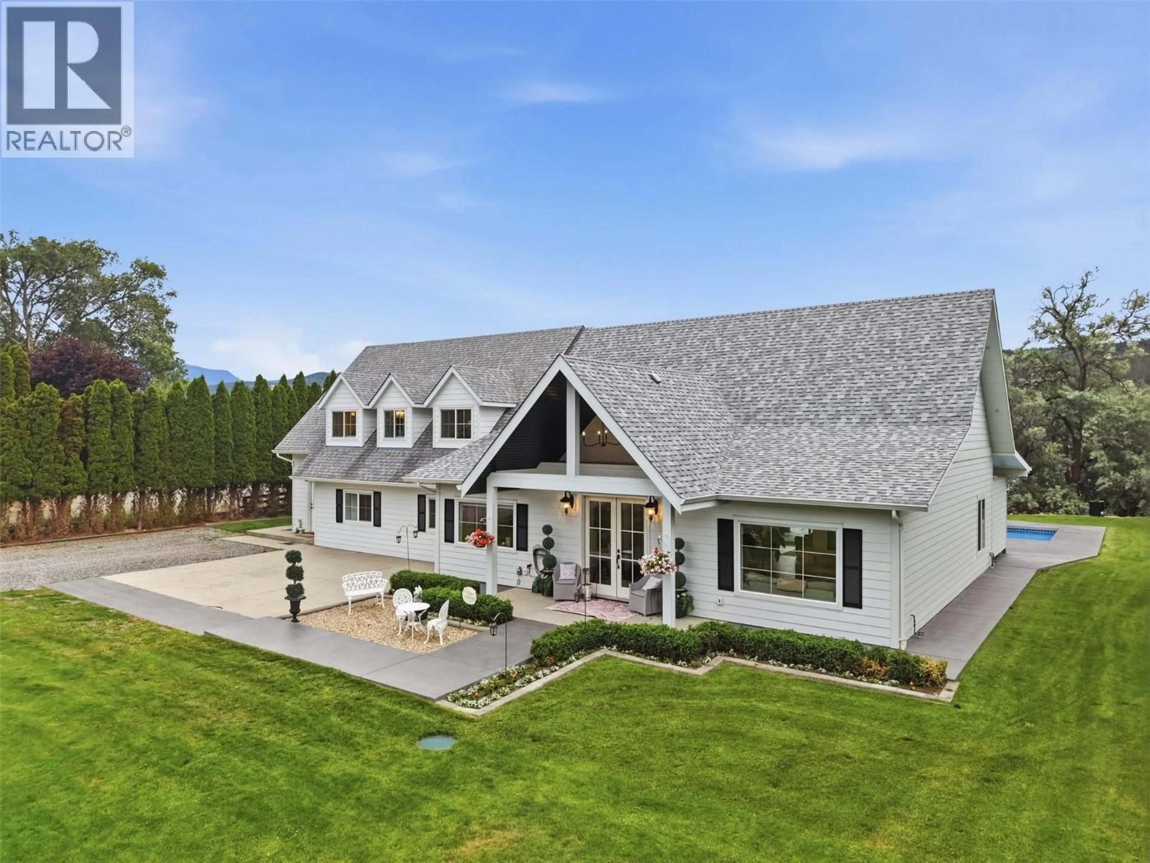 A pic from outside/outdoor area/front of a property/back of a property/a pic from drone, mountain view for 3724 SHUSWAP ROAD, Kamloops British Columbia V2H1S6