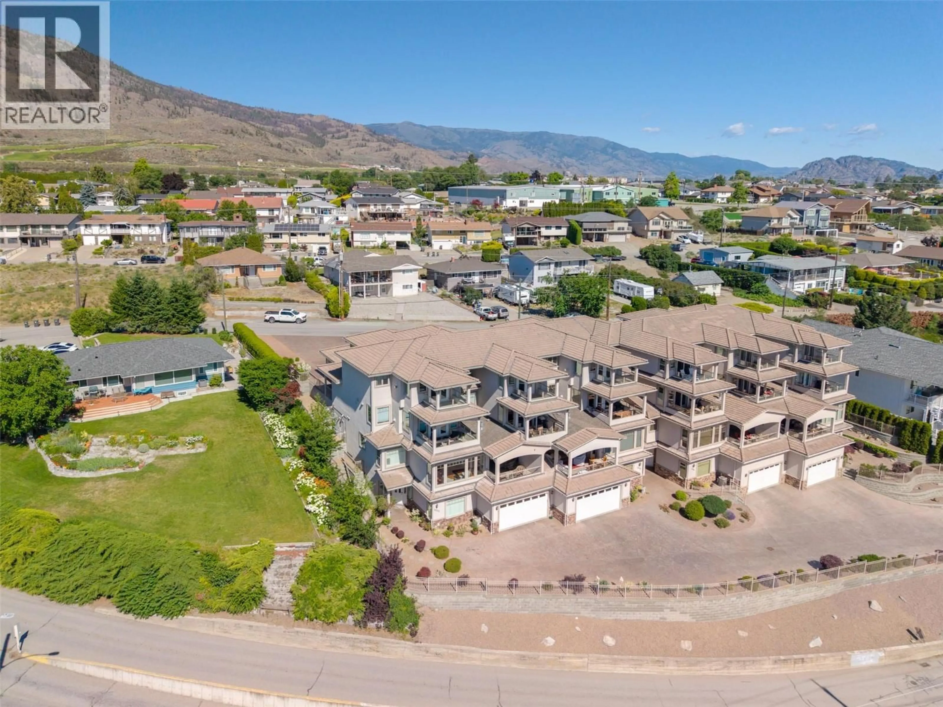 A pic from outside/outdoor area/front of a property/back of a property/a pic from drone, mountain view for 6202 89TH STREET, Osoyoos British Columbia V0H1V1