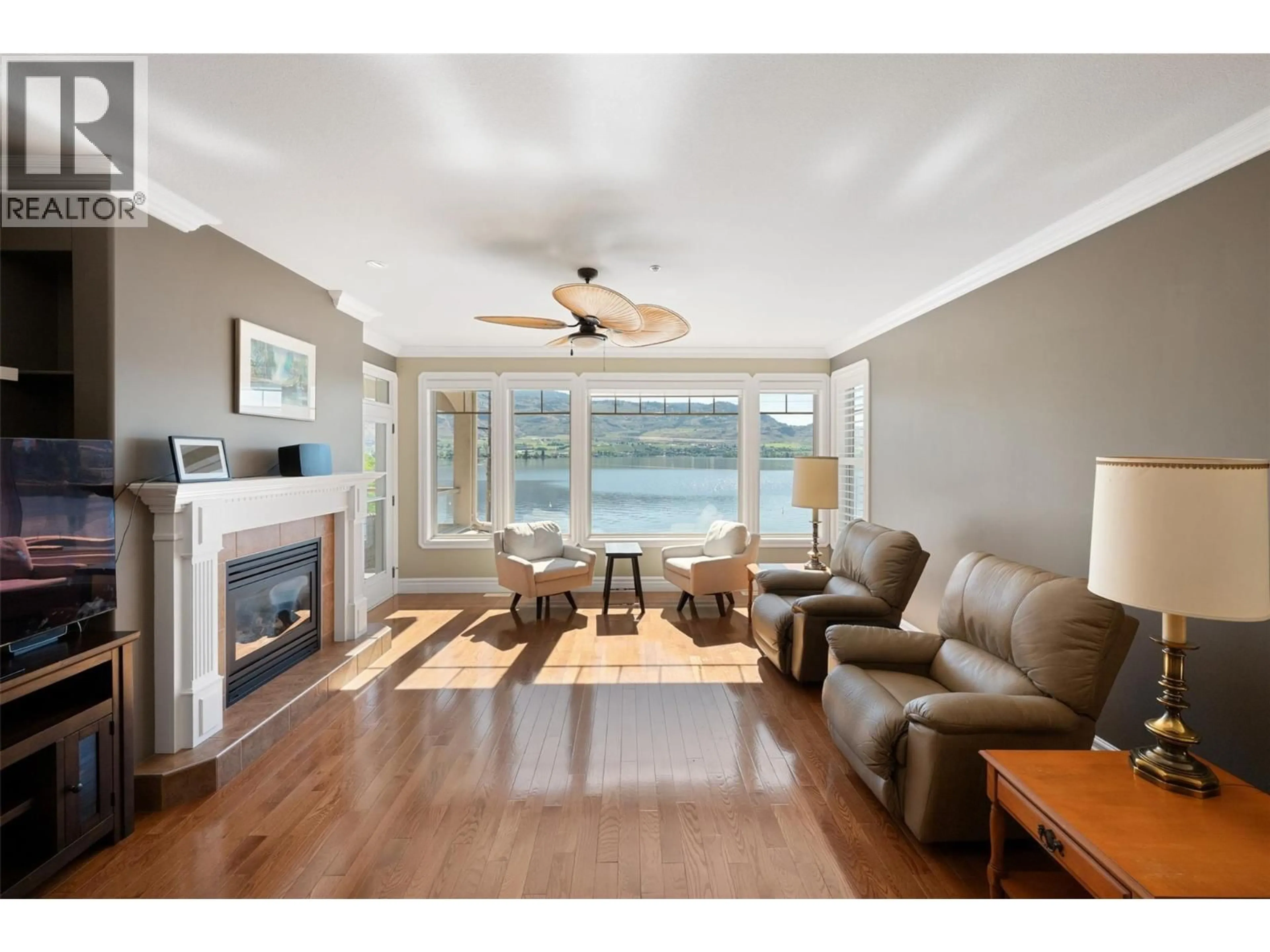 Living room with furniture, wood/laminate floor for 6202 89TH STREET, Osoyoos British Columbia V0H1V1