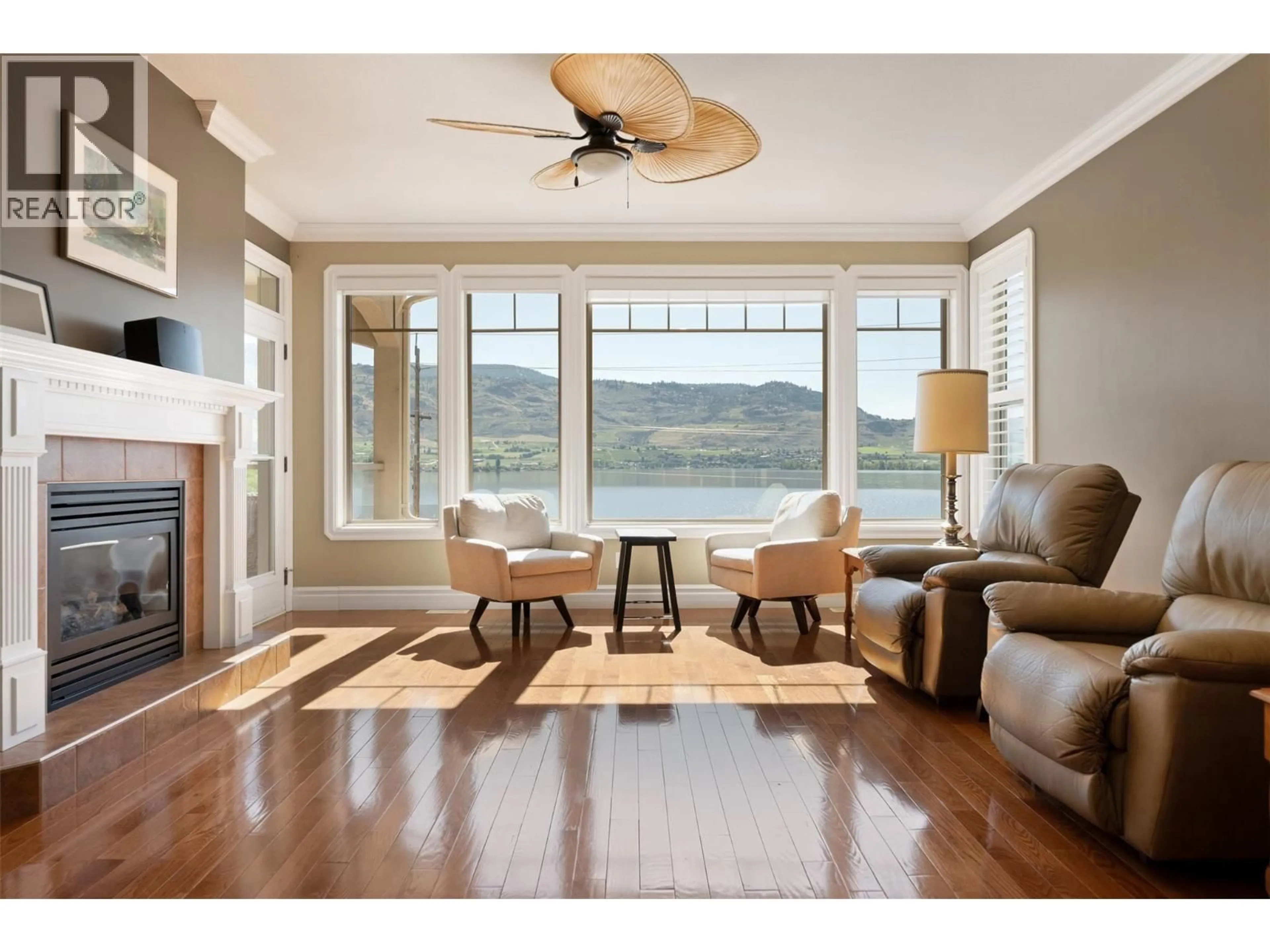 Living room with furniture, wood/laminate floor for 6202 89TH STREET, Osoyoos British Columbia V0H1V1