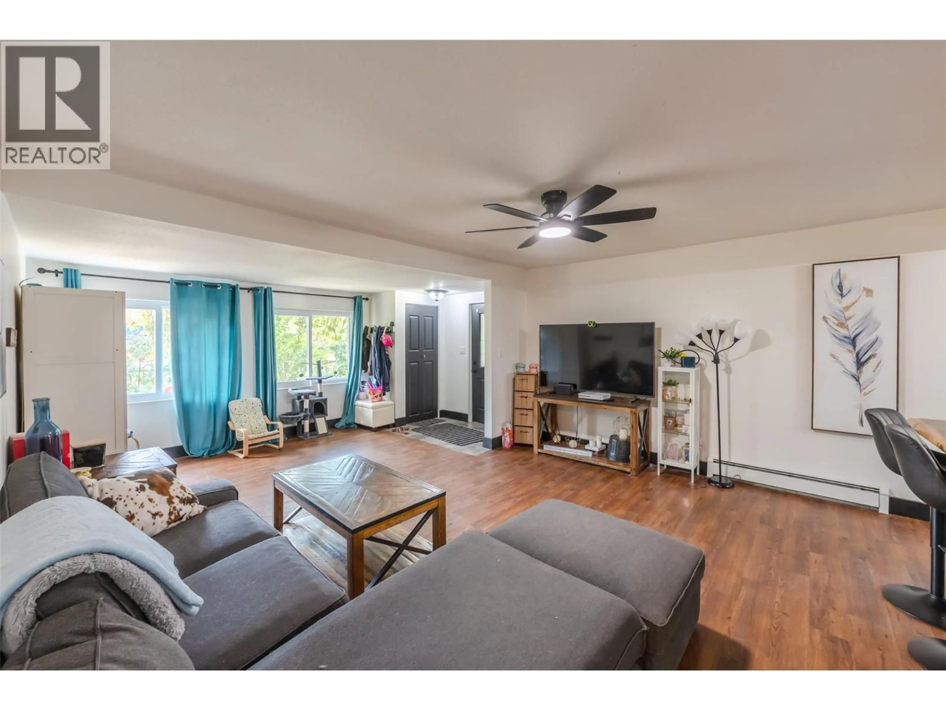 Living room with furniture, wood/laminate floor for 2122 MAIN STREET, Cawston British Columbia V0X1C1