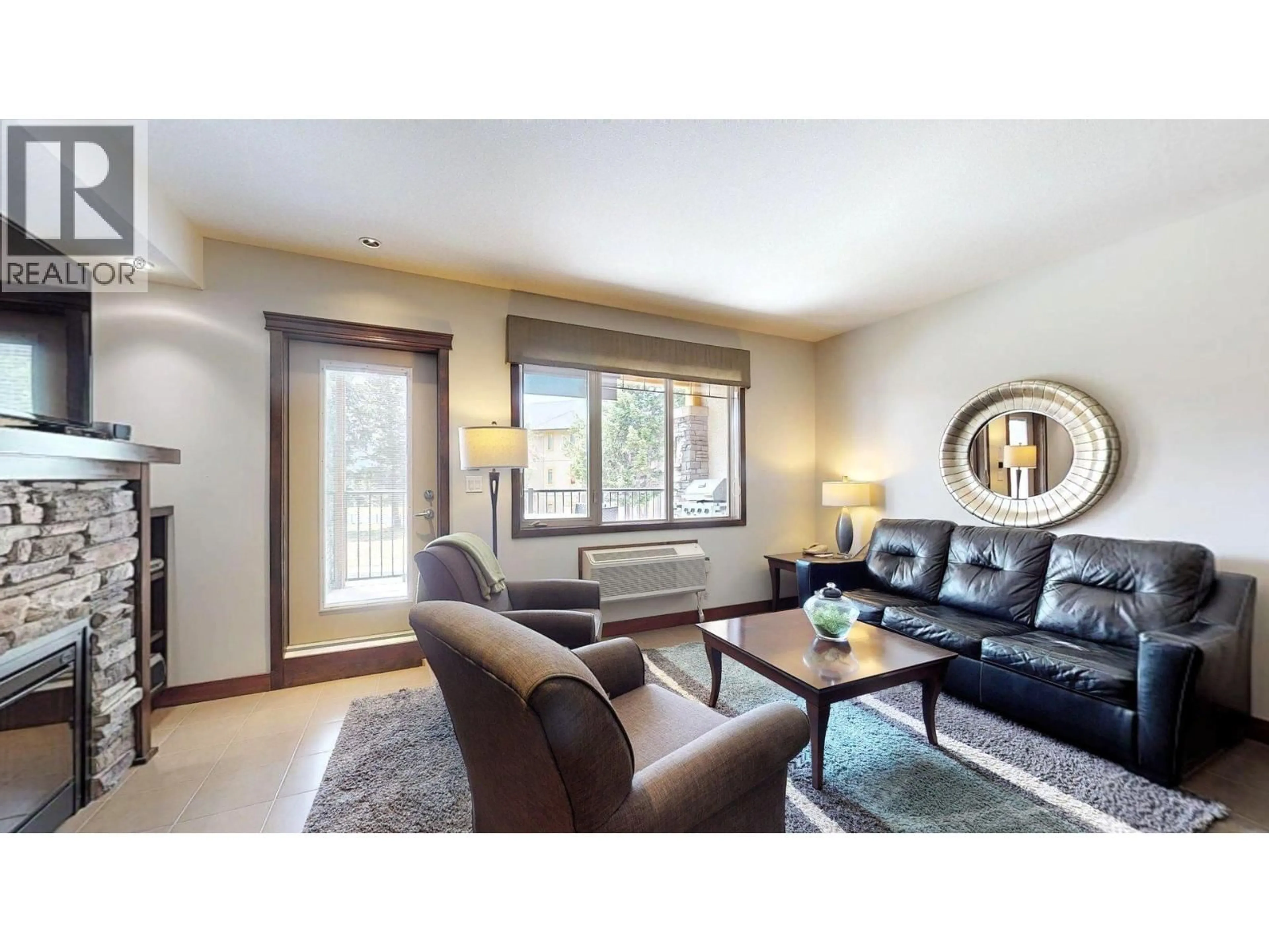 Living room with furniture, wood/laminate floor for 715 E - 700 BIGHORN BOULEVARD, Radium Hot Springs British Columbia V0A1M0