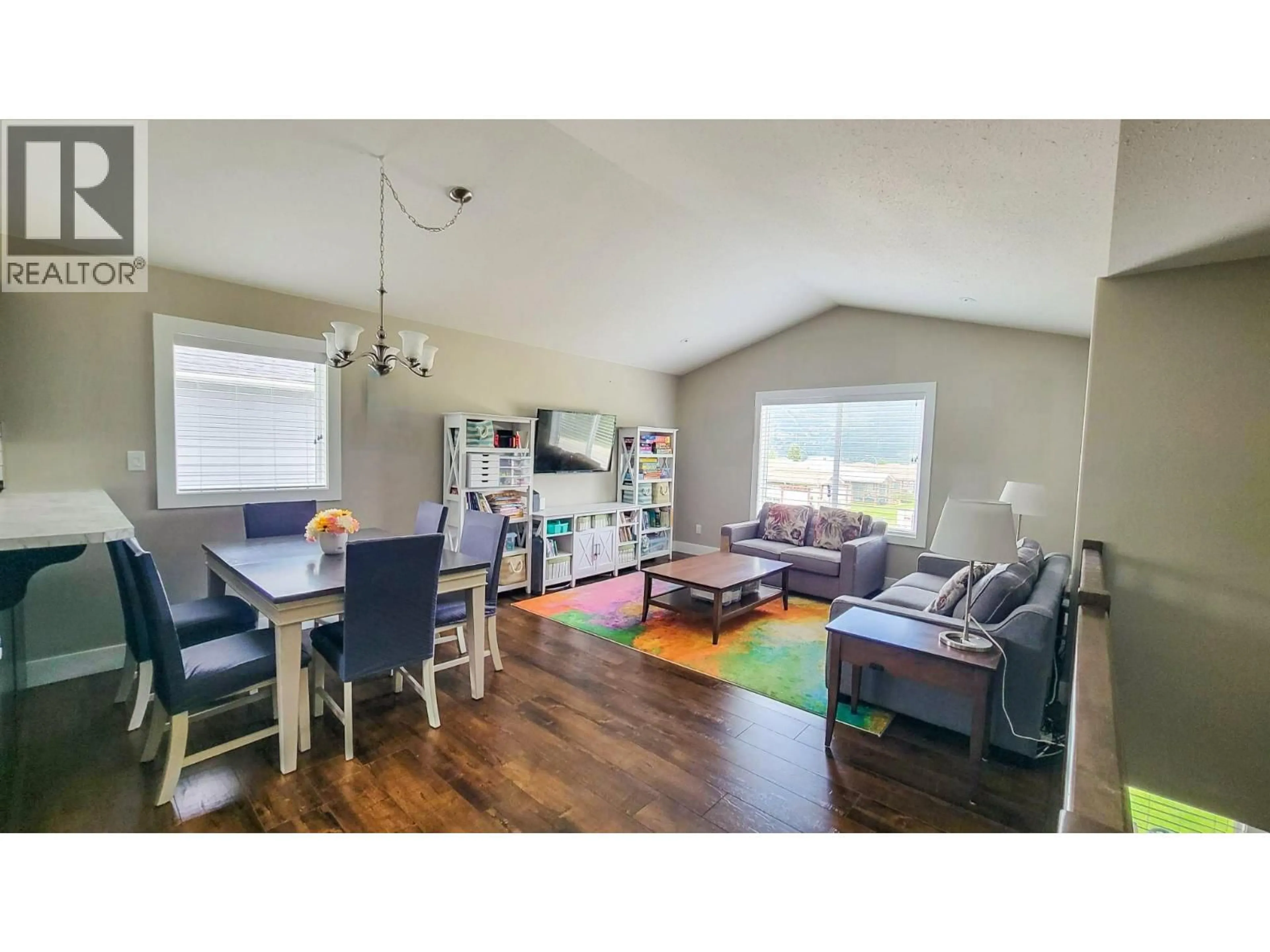 Living room with furniture, wood/laminate floor for 4208 16TH AVENUE, Castlegar British Columbia V1N4X7