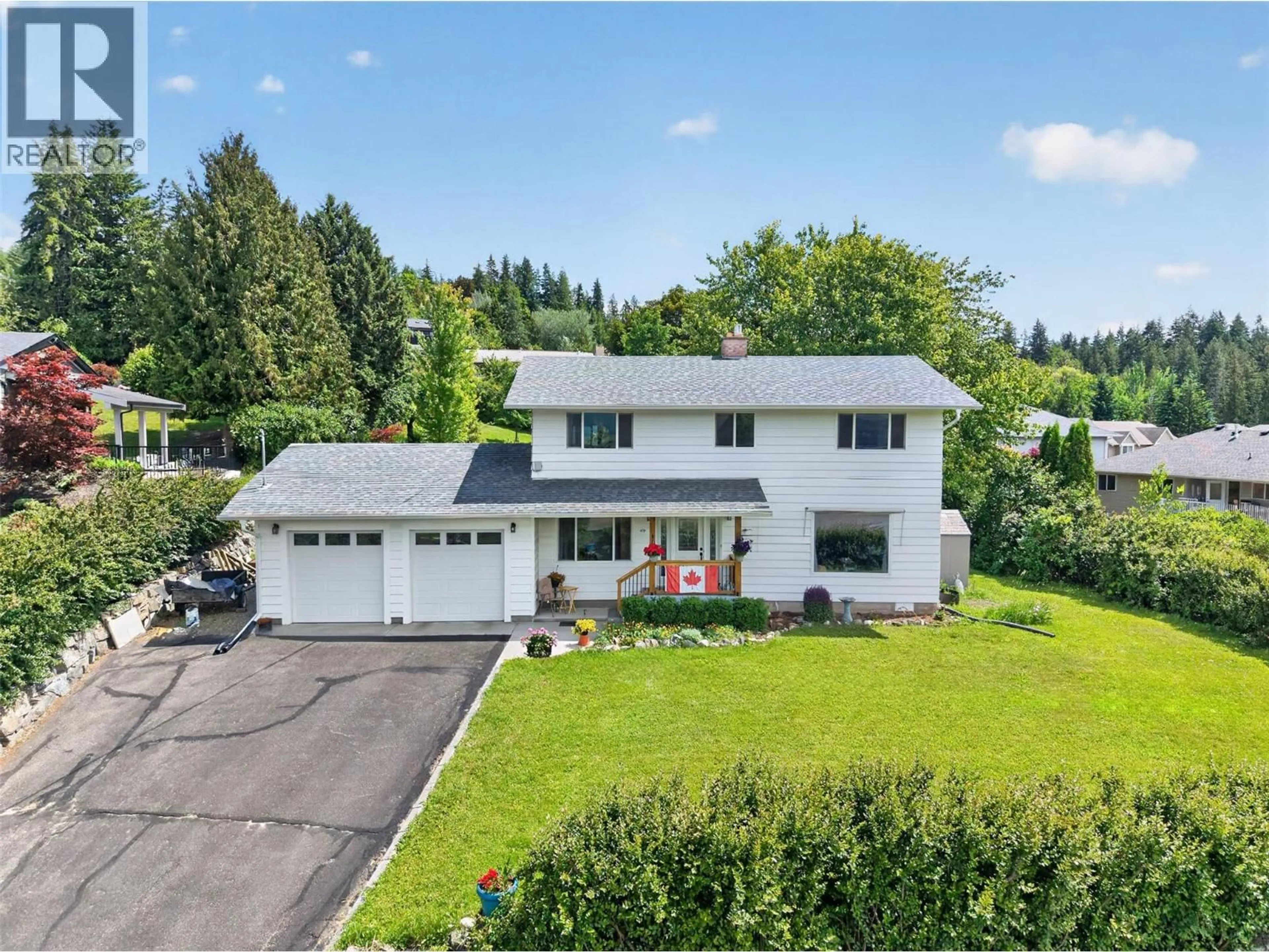 A pic from outside/outdoor area/front of a property/back of a property/a pic from drone, street for 2460 23 STREET NORTHEAST, Salmon Arm British Columbia V1E3Y4