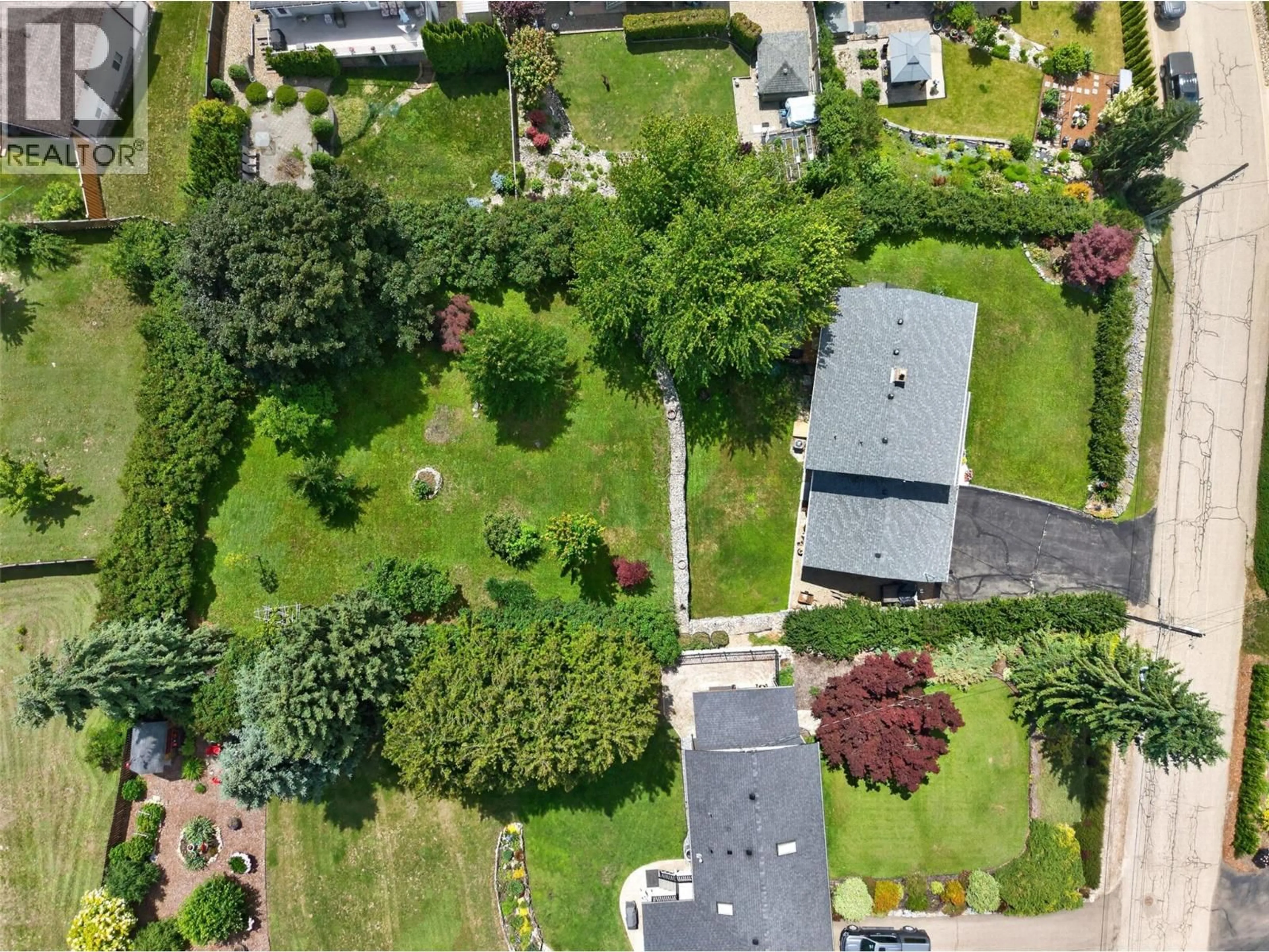 A pic from outside/outdoor area/front of a property/back of a property/a pic from drone, street for 2460 23 STREET NORTHEAST, Salmon Arm British Columbia V1E3Y4