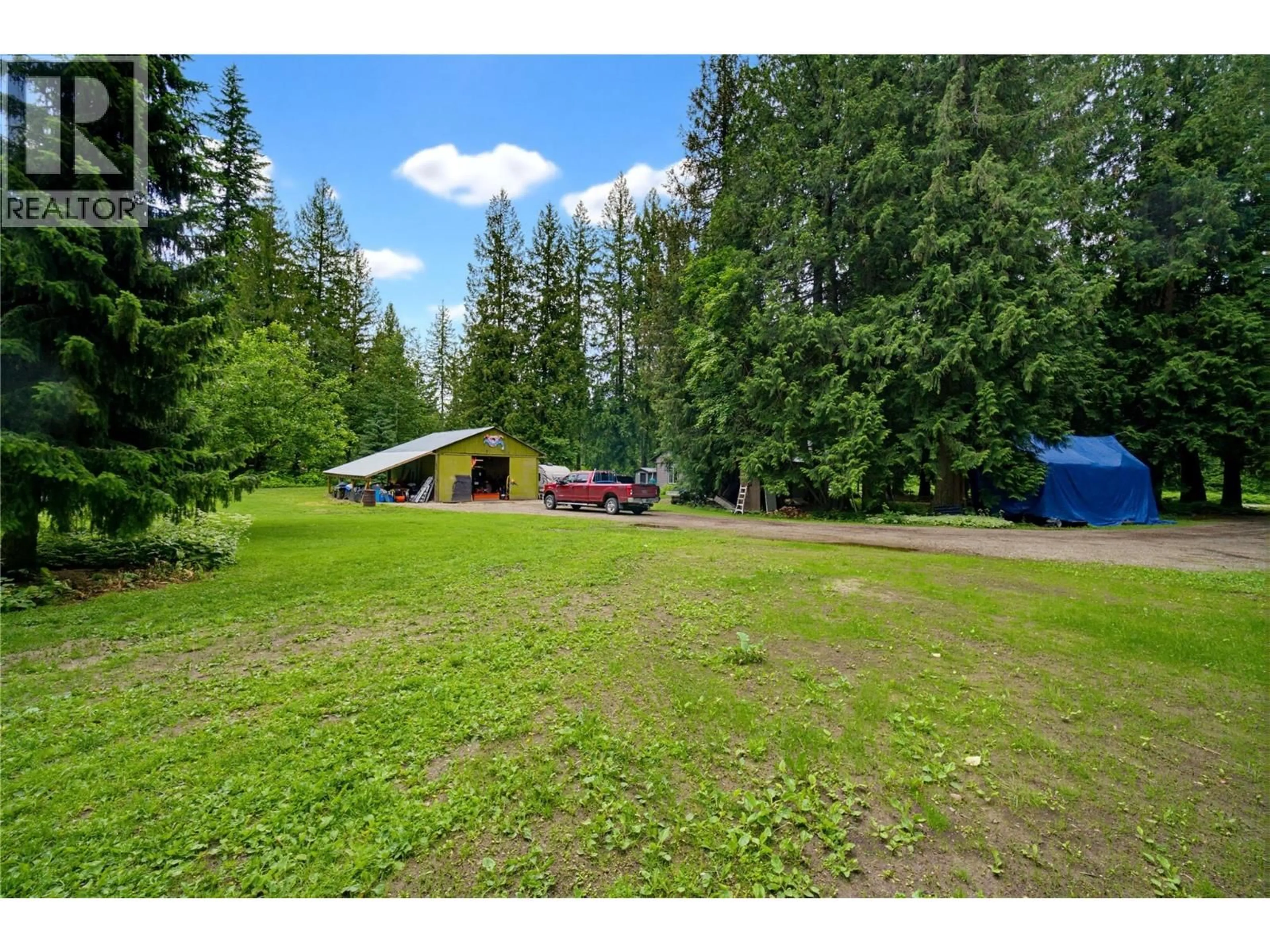 A pic from outside/outdoor area/front of a property/back of a property/a pic from drone, forest/trees view for 1989 BUNDUS ROAD, Sicamous British Columbia V0E2V5