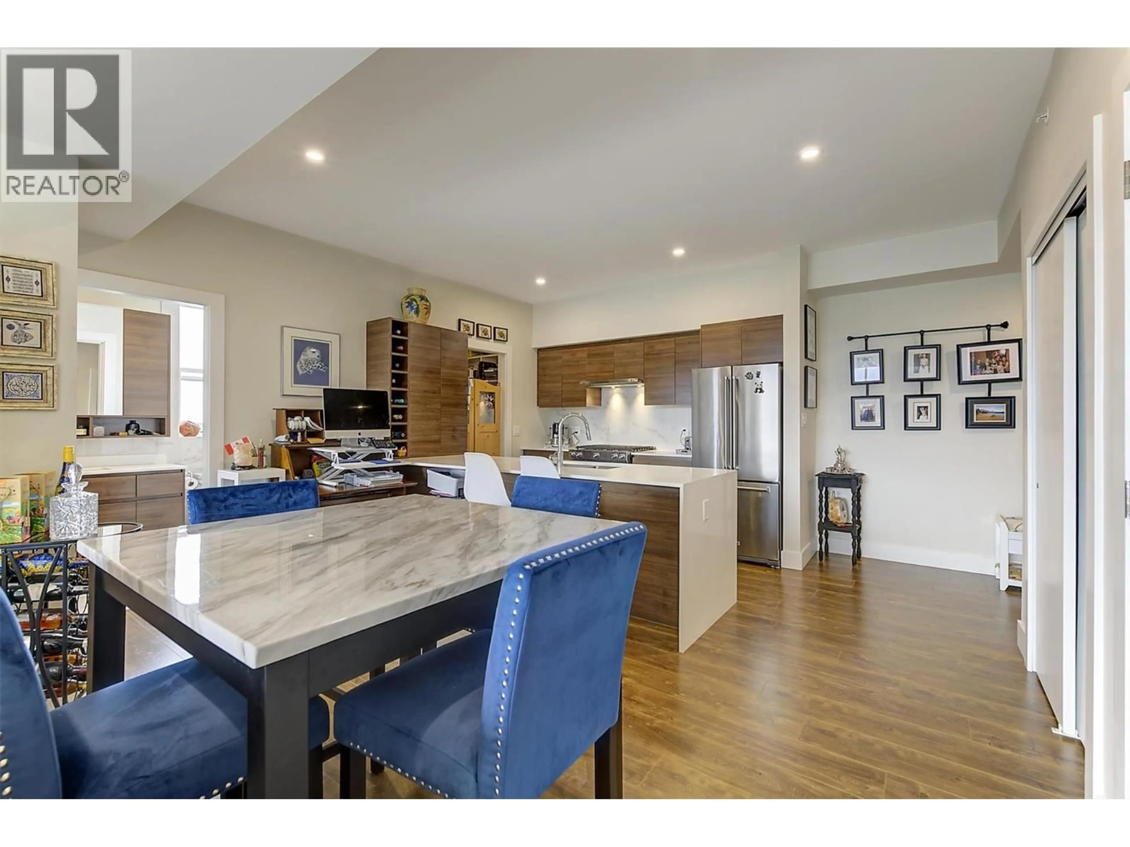 Open concept kitchen, wood/laminate floor for 608 - 1925 ENTERPRISE WAY, Kelowna British Columbia V1Y0J8