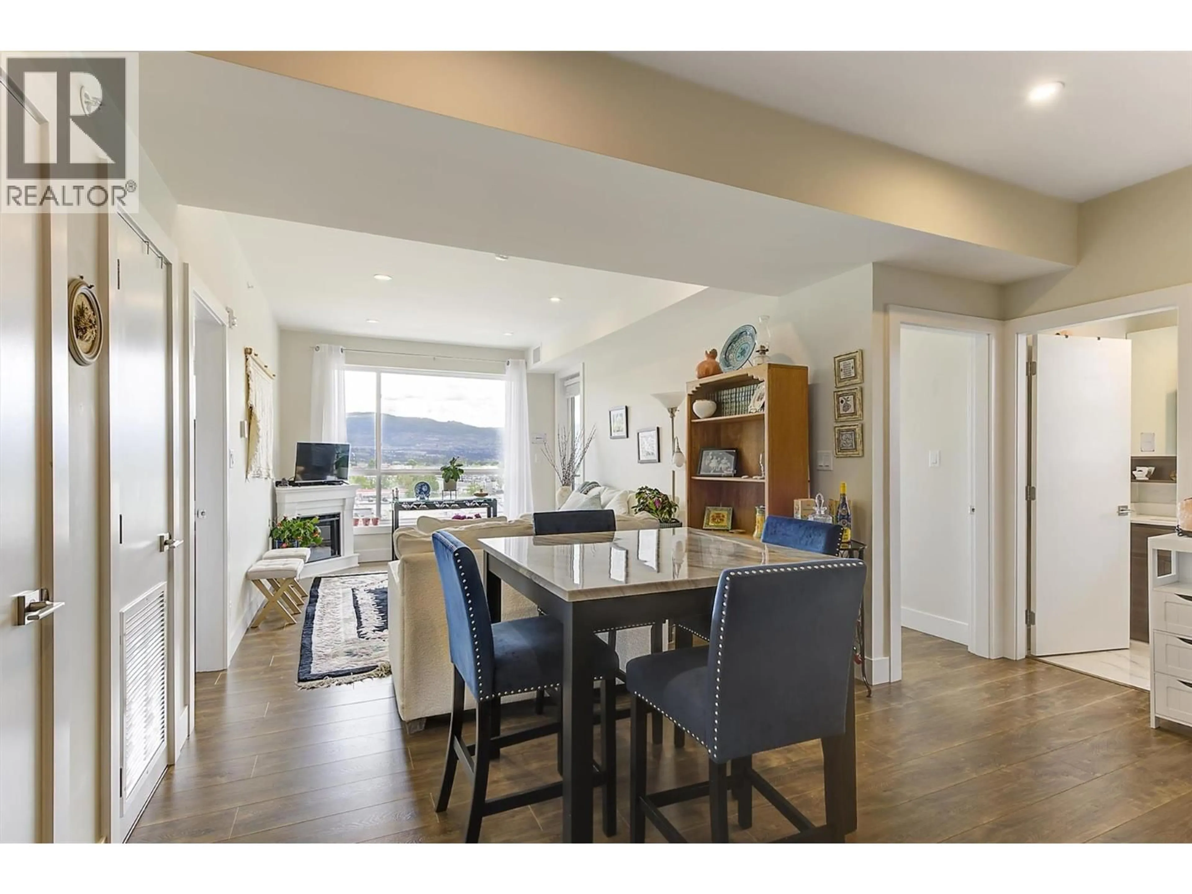 Open concept kitchen, wood/laminate floor for 608 - 1925 ENTERPRISE WAY, Kelowna British Columbia V1Y0J8