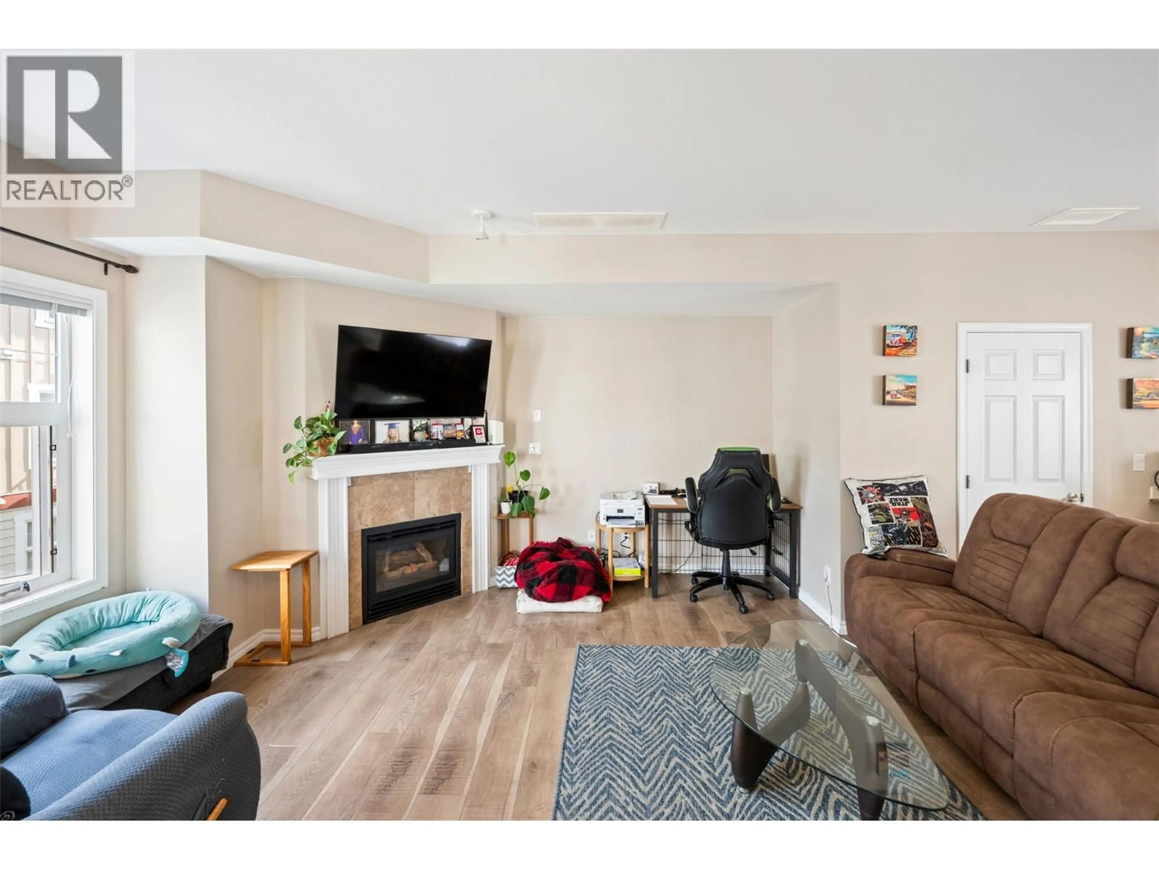 Living room with furniture, wood/laminate floor for 128 - 3363 WILSON STREET, Penticton British Columbia V2A8E3