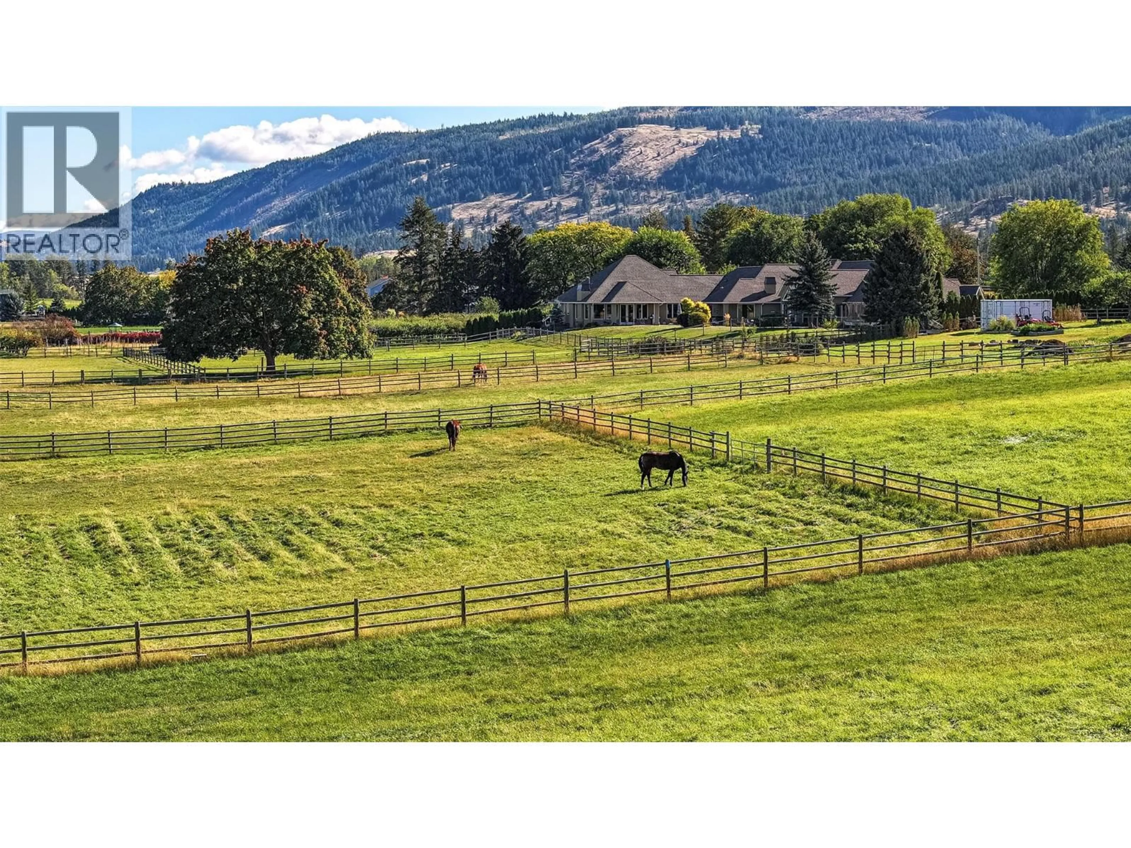 A pic from outside/outdoor area/front of a property/back of a property/a pic from drone, mountain view for 9109 MACKIE DRIVE, Coldstream British Columbia V1B1H1