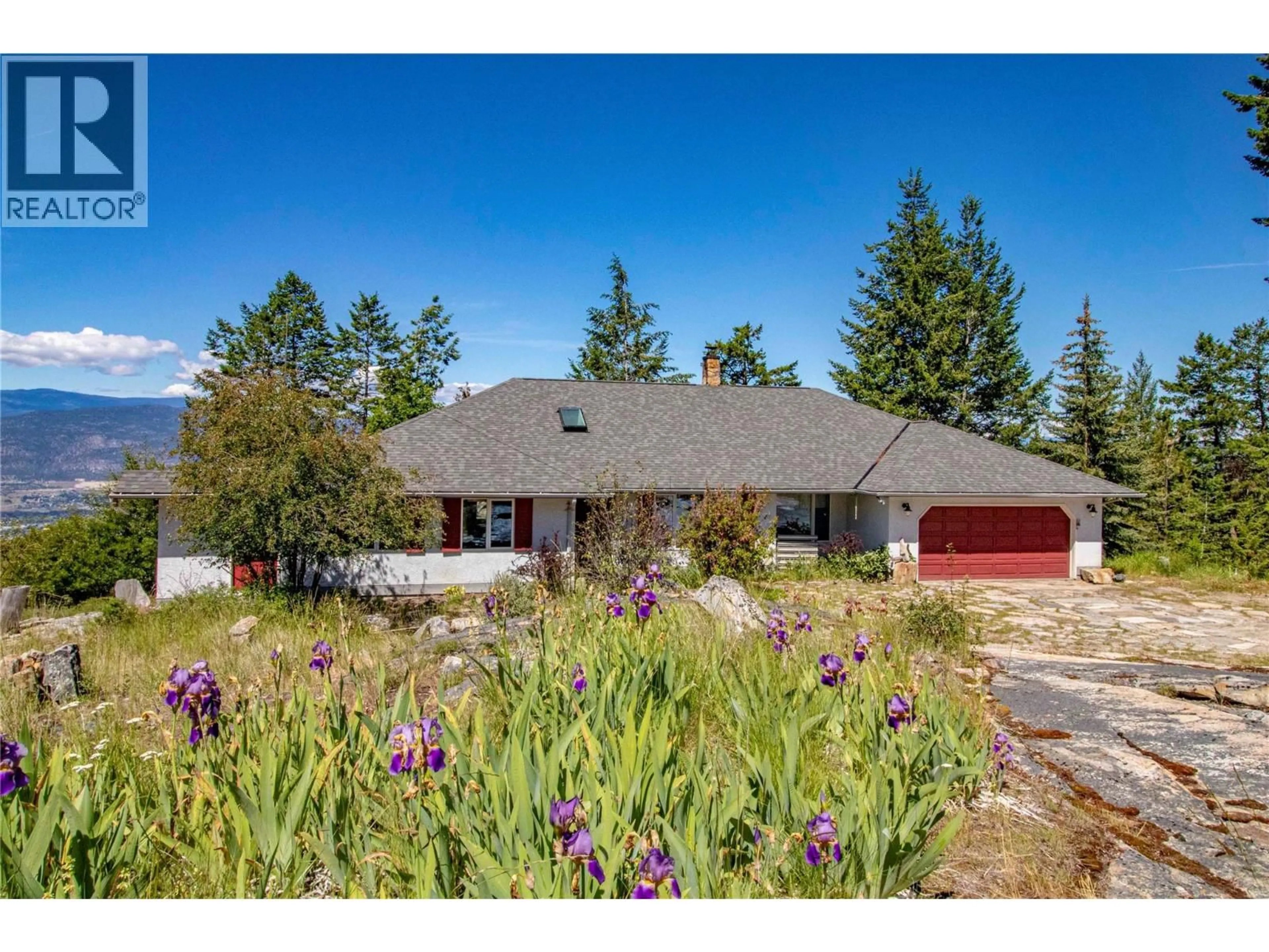 A pic from outside/outdoor area/front of a property/back of a property/a pic from drone, street for 2263 CARMI ROAD, Penticton British Columbia V2A8V5