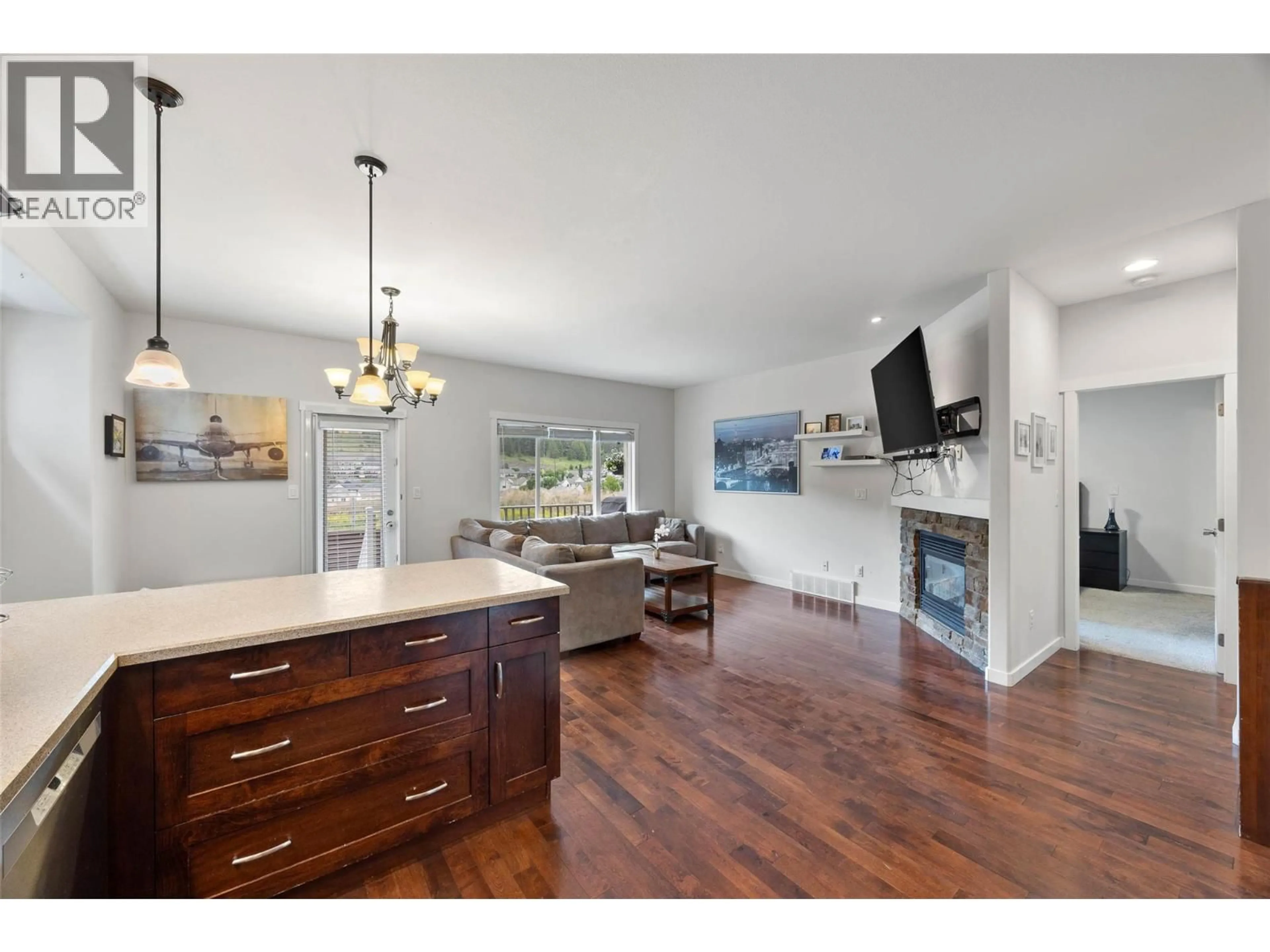 Open concept kitchen, wood/laminate floor for 1808 FOXTAIL DRIVE, Kamloops British Columbia V1S0A4
