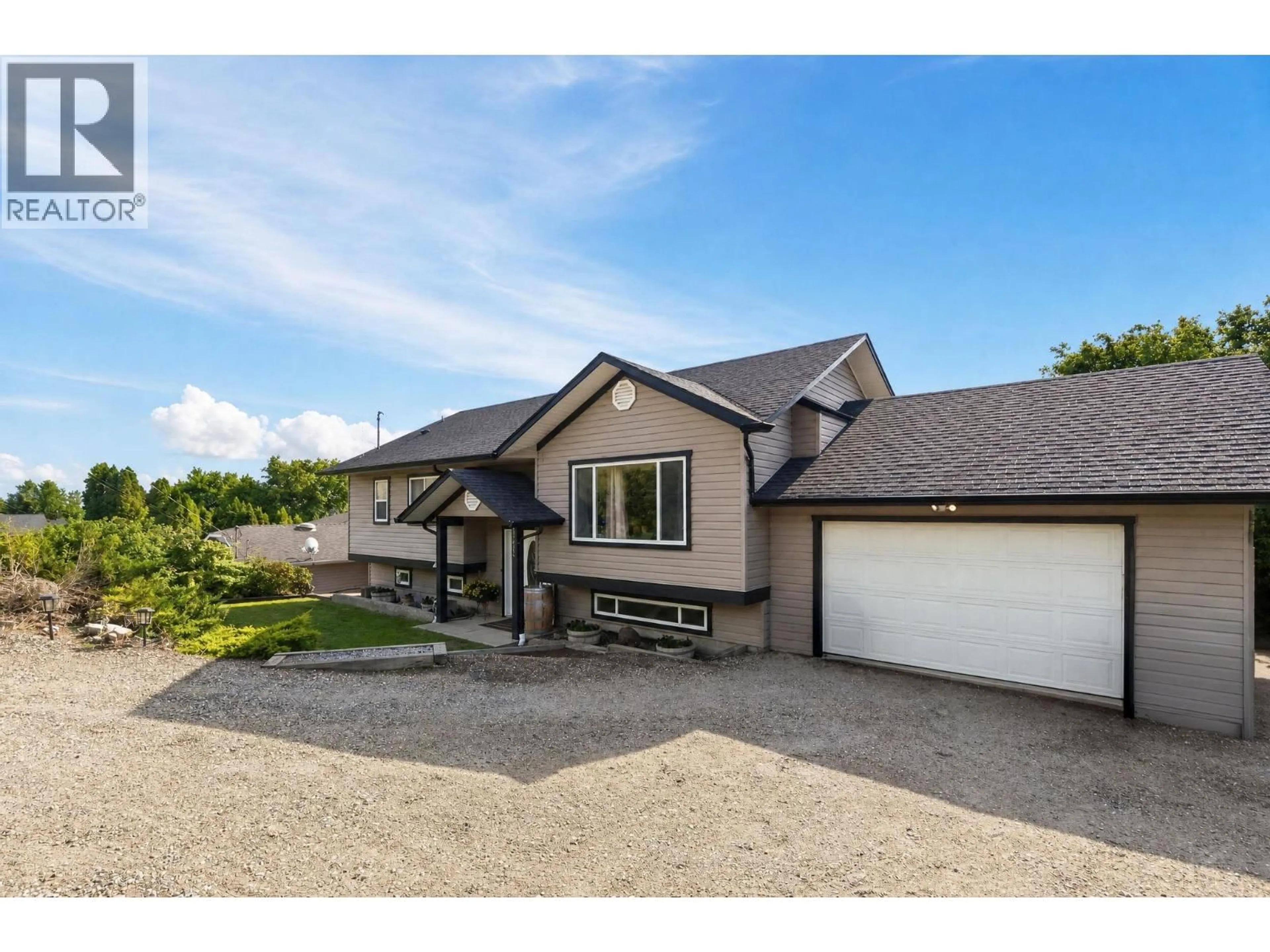 A pic from outside/outdoor area/front of a property/back of a property/a pic from drone, street for 10910 VELDA ROAD, Lake Country British Columbia V4V1W7