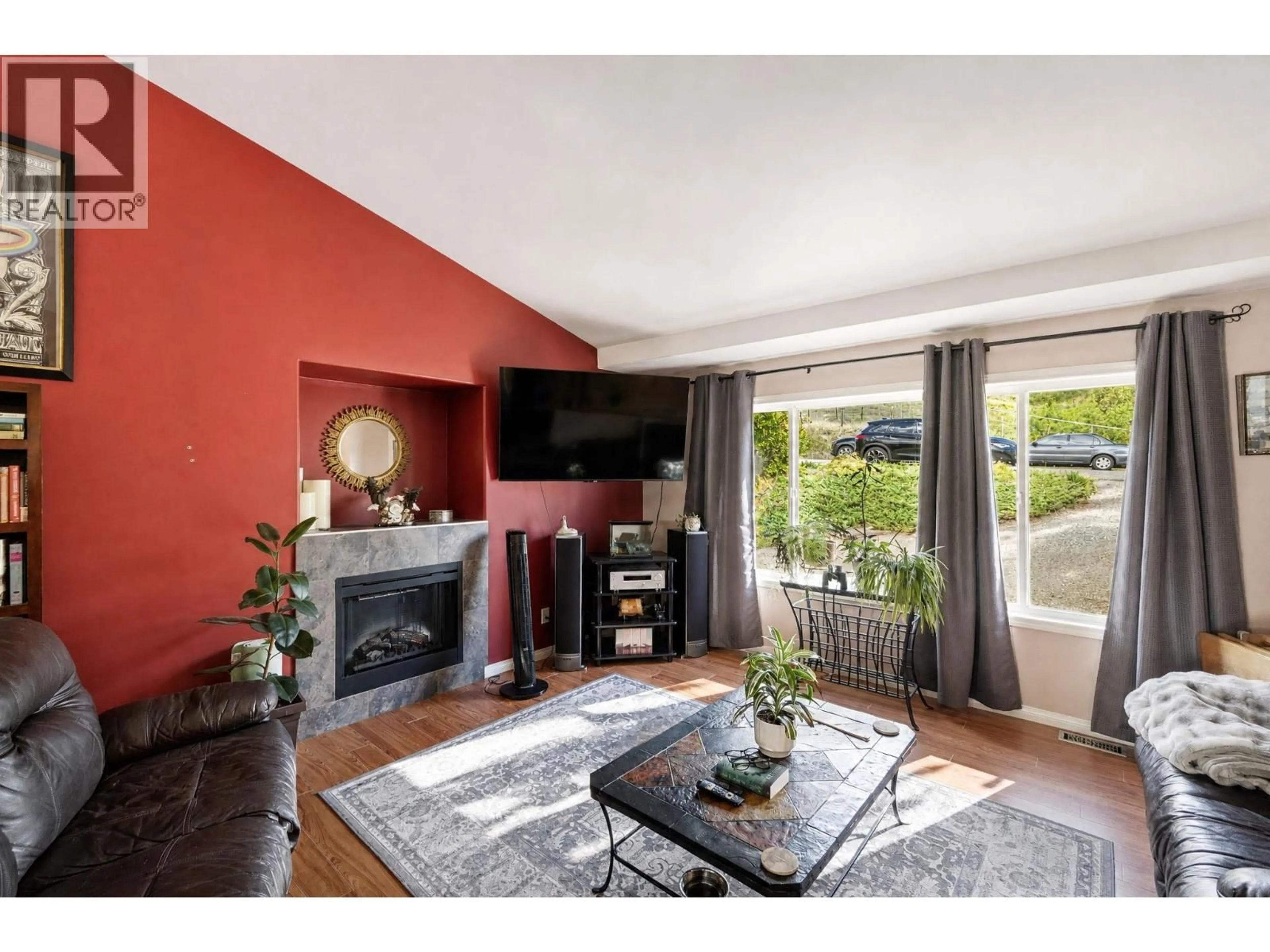 Living room with furniture, wood/laminate floor for 10910 VELDA ROAD, Lake Country British Columbia V4V1W7