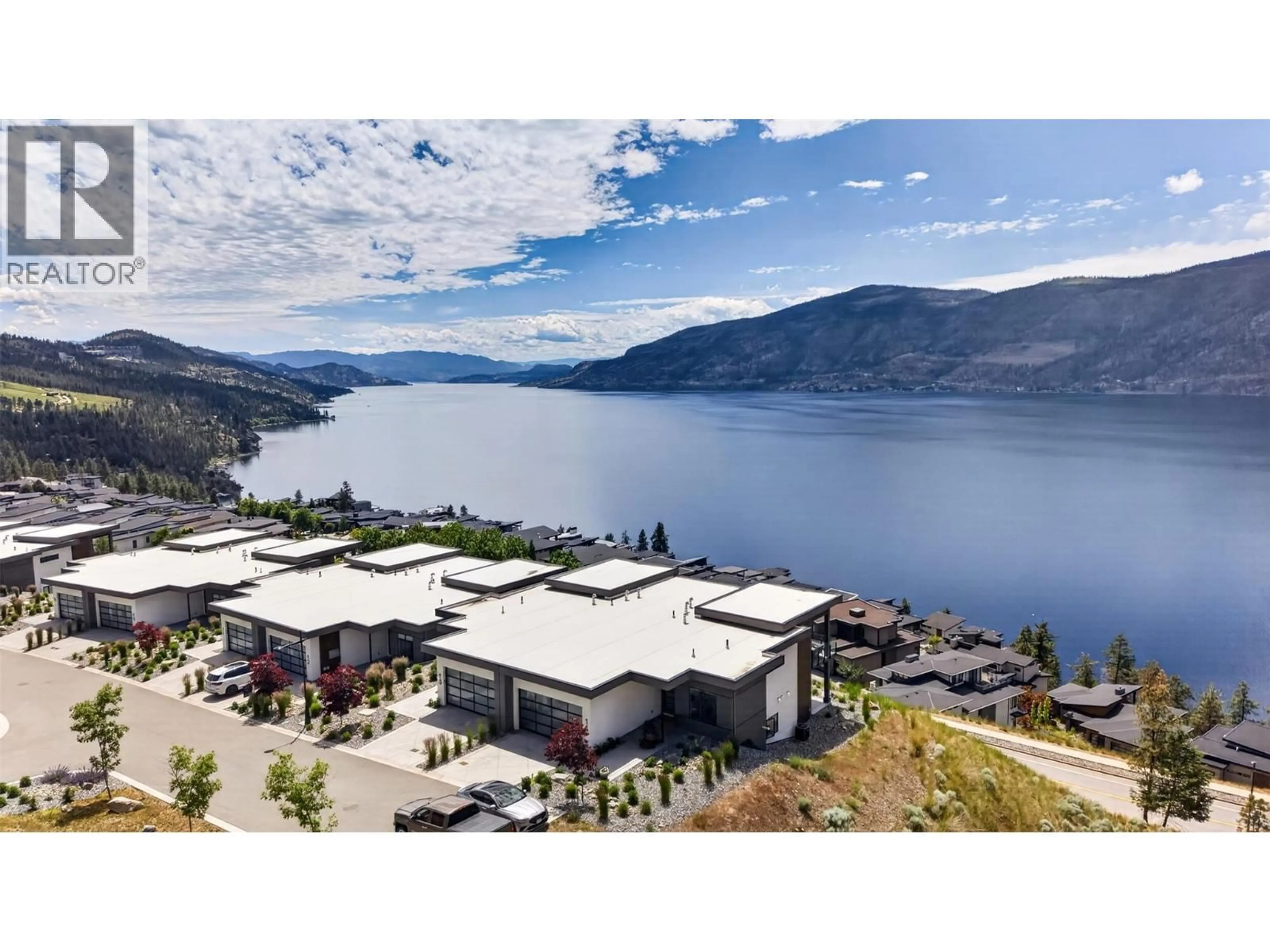 A pic from outside/outdoor area/front of a property/back of a property/a pic from drone, water/lake/river/ocean view for 13 - 9201 OKANAGAN CENTRE ROAD WEST, Lake Country British Columbia V4V0B8
