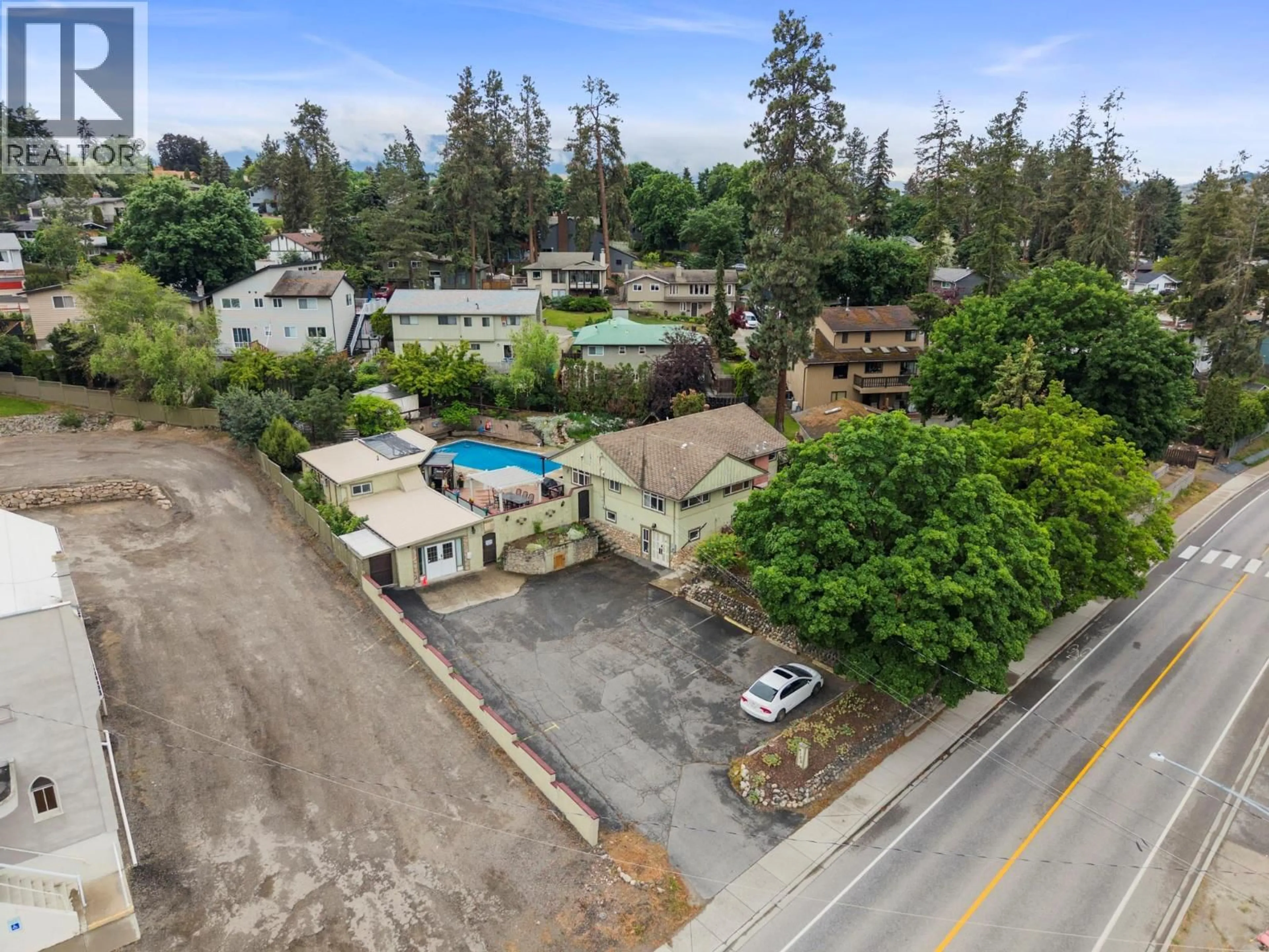 A pic from outside/outdoor area/front of a property/back of a property/a pic from drone, street for 4105 PLEASANT VALLEY ROAD, Vernon British Columbia V1T4M1