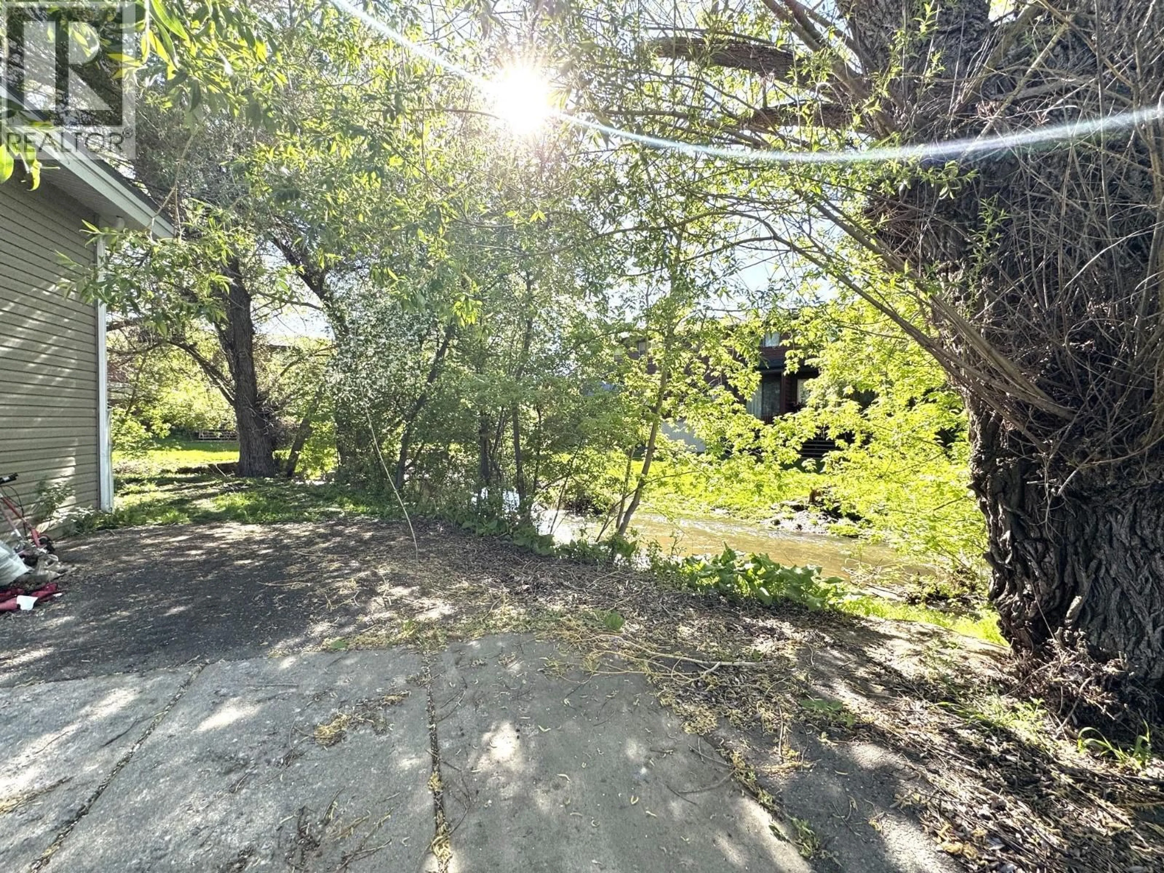 A pic from outside/outdoor area/front of a property/back of a property/a pic from drone, forest/trees view for 1803 4TH STREET NORTH, Cranbrook British Columbia V1C3L9