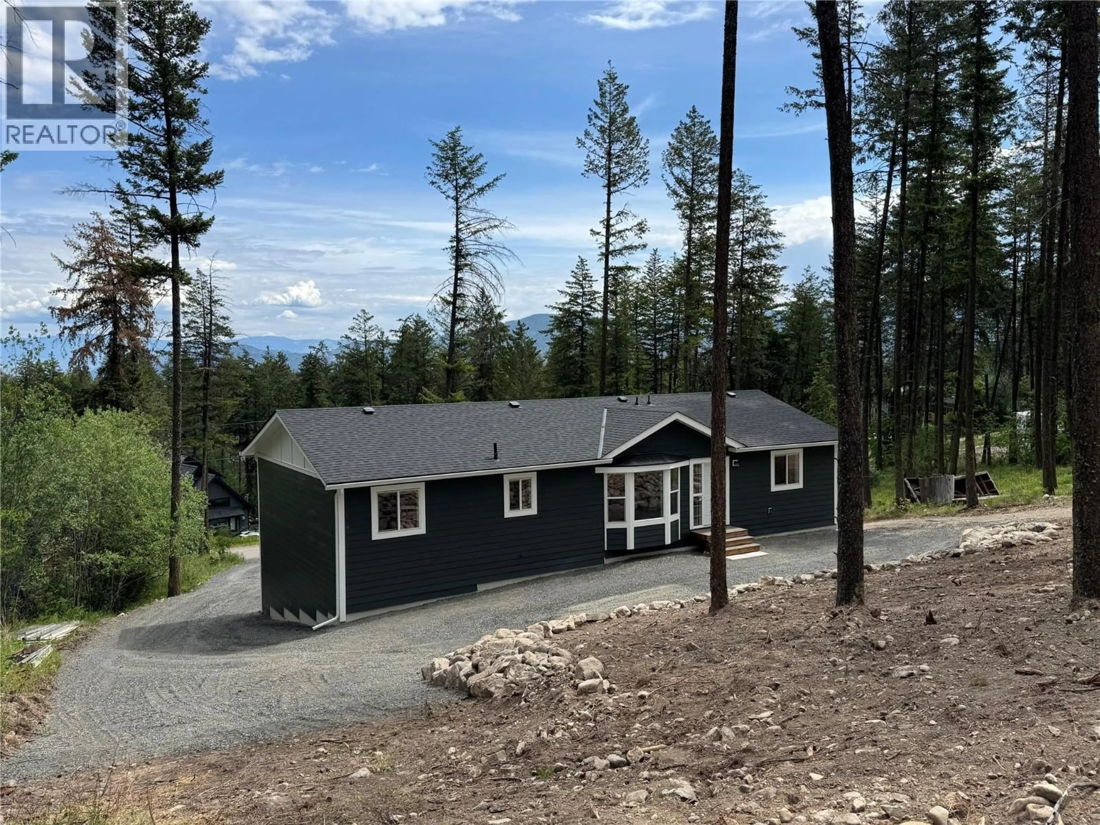 A pic from outside/outdoor area/front of a property/back of a property/a pic from drone, mountain view for 7932 ALPINE ROAD, Kelowna British Columbia V1Z3V4