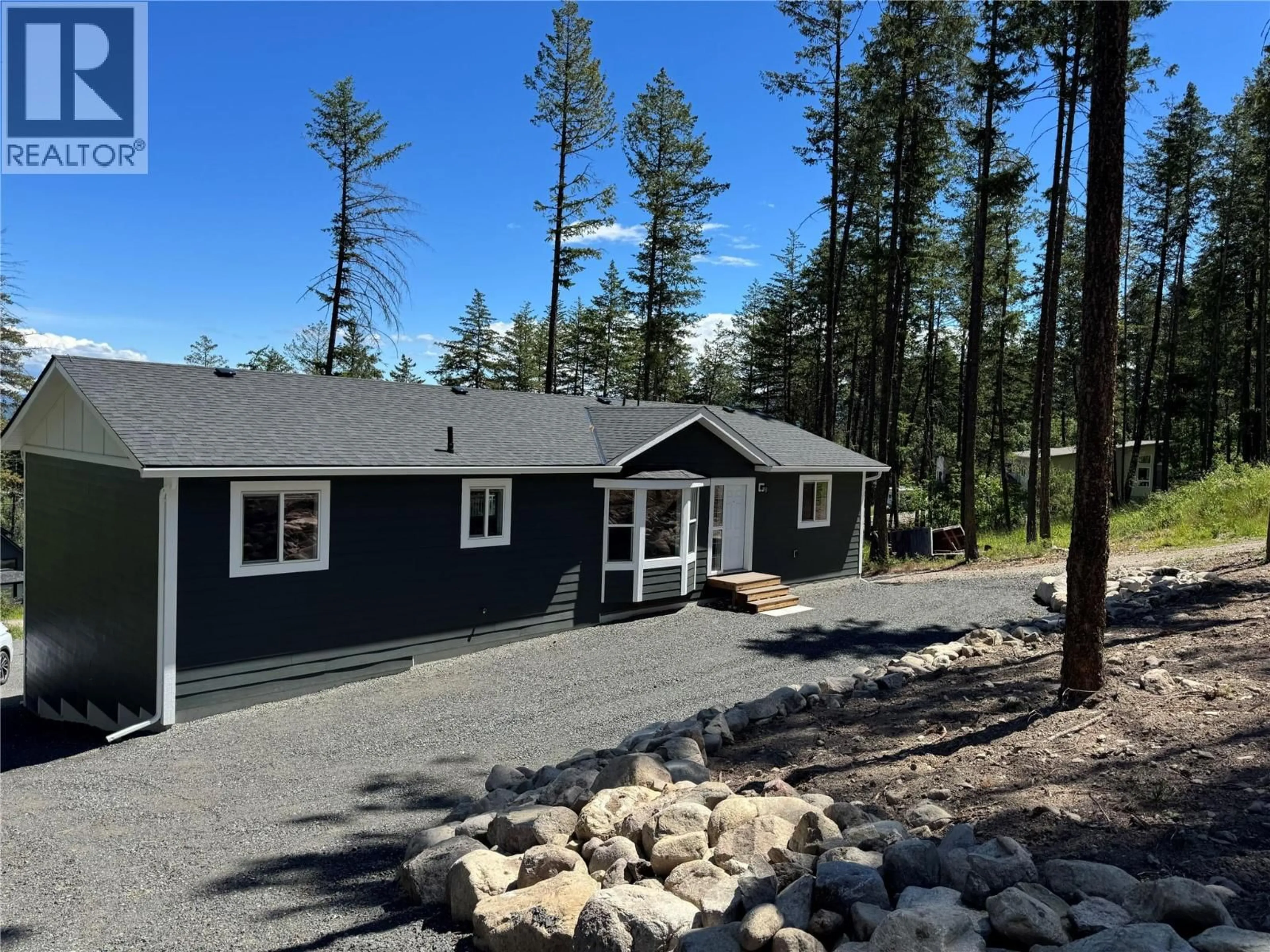Home with vinyl exterior material, forest/trees view for 7932 ALPINE ROAD, Kelowna British Columbia V1Z3V4