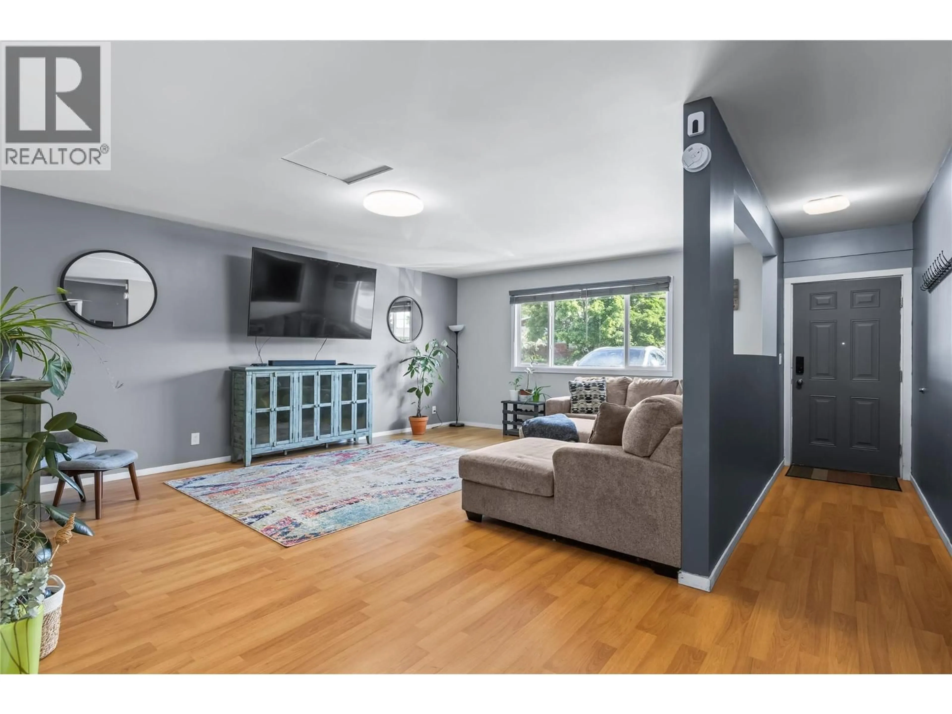 Living room with furniture, unknown for 440 PRIMROSE ROAD, Kelowna British Columbia V1X2G7