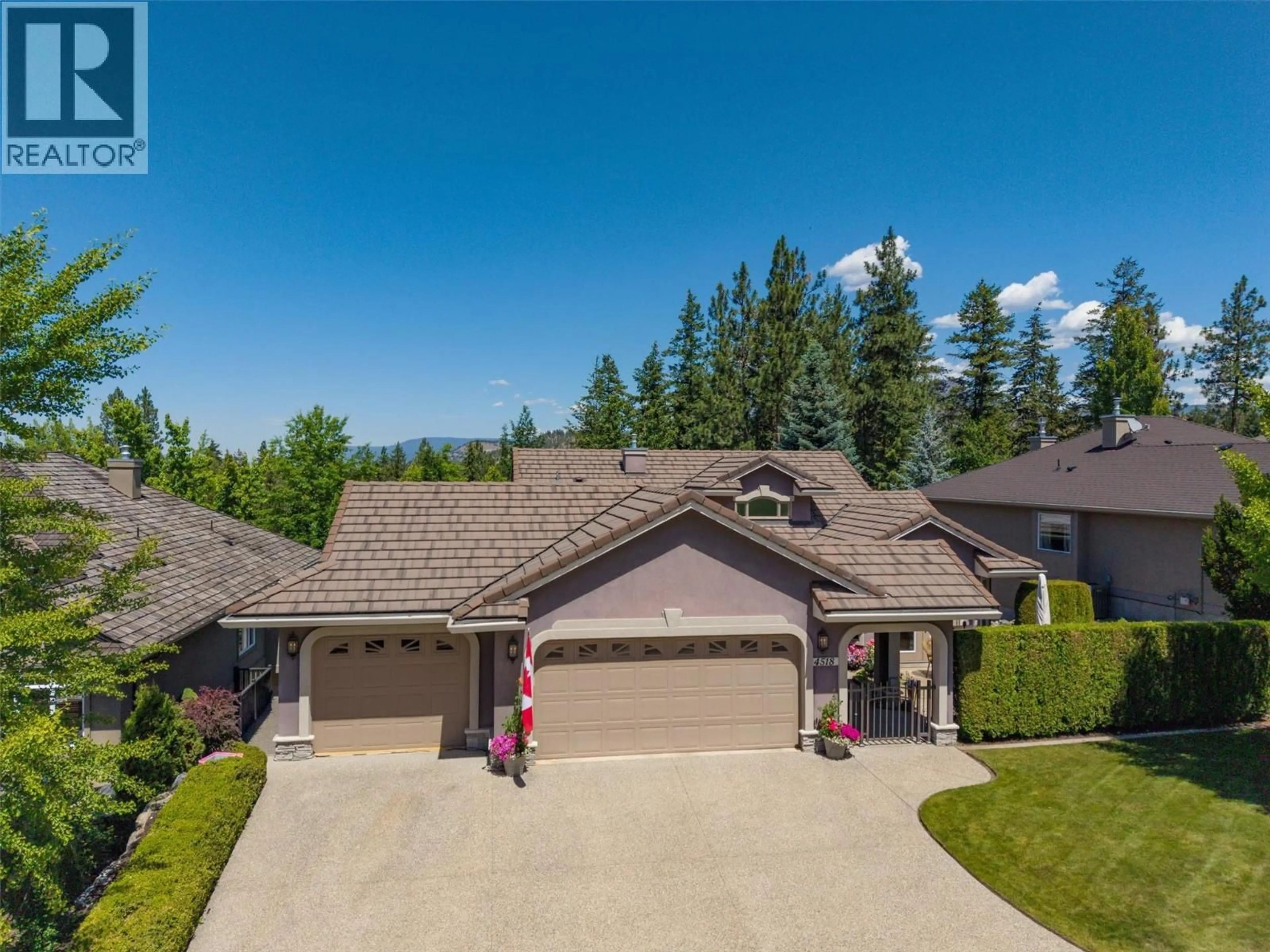 A pic from outside/outdoor area/front of a property/back of a property/a pic from drone, mountain view for 4518 GALLAGHERS EDGEWOOD COURT, Kelowna British Columbia V1W5B6