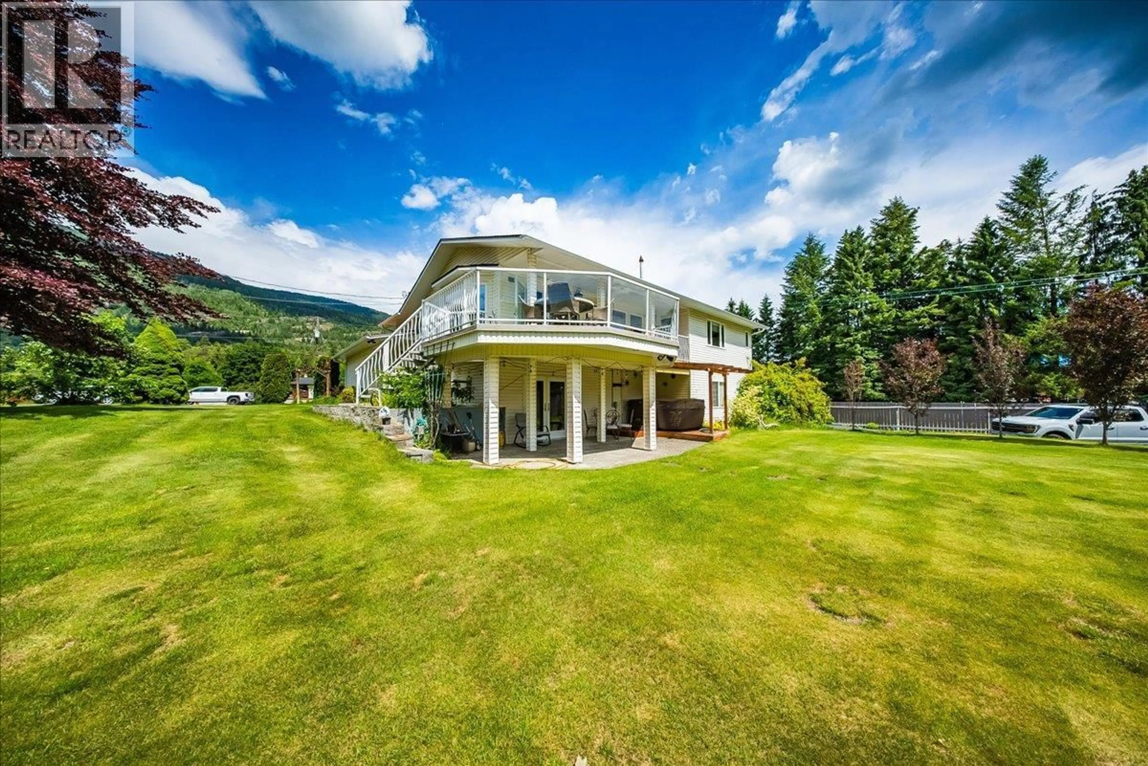 A pic from outside/outdoor area/front of a property/back of a property/a pic from drone, mountain view for 412 14TH AVENUE, Genelle British Columbia V0G1G0