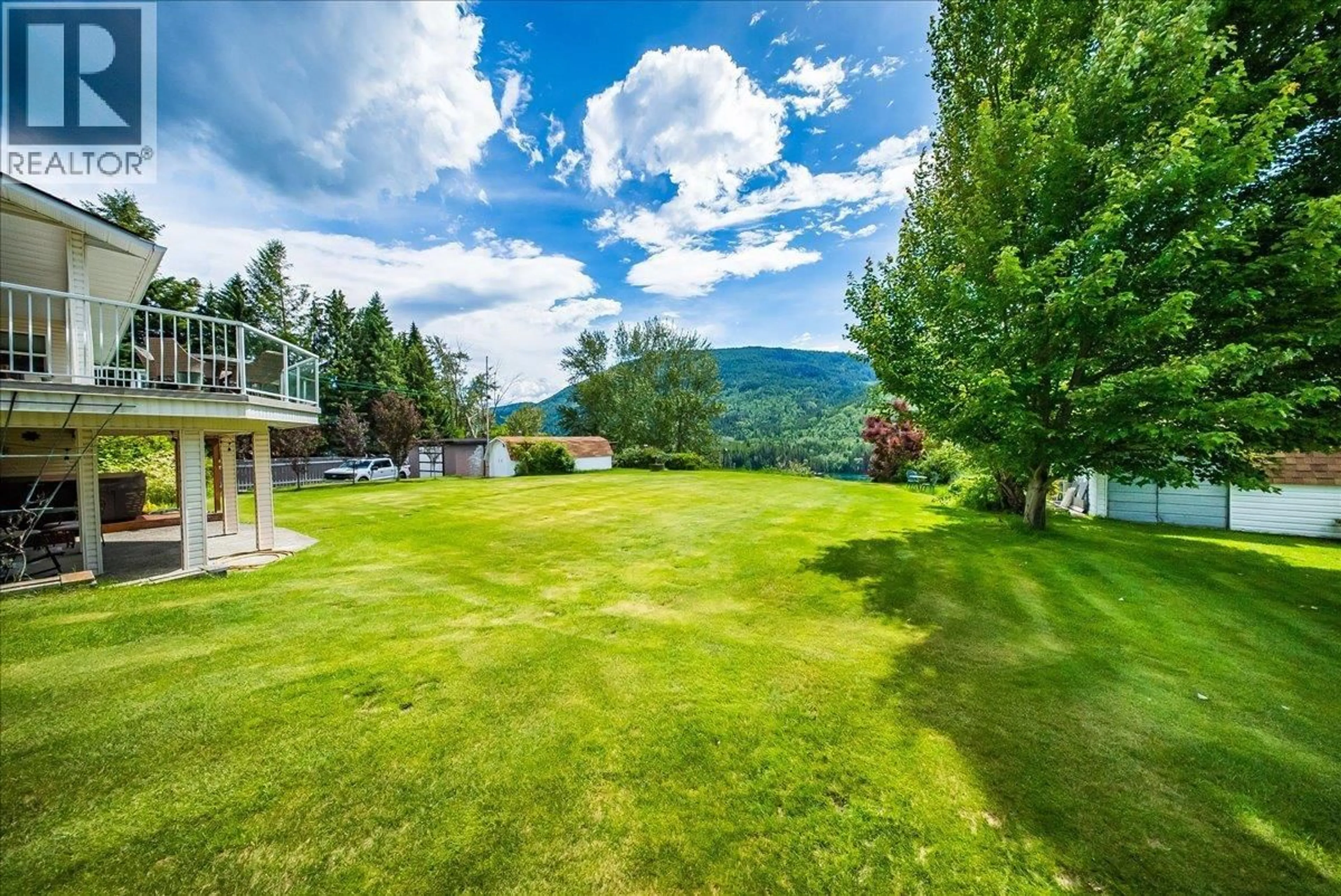 A pic from outside/outdoor area/front of a property/back of a property/a pic from drone, water/lake/river/ocean view for 412 14TH AVENUE, Genelle British Columbia V0G1G0