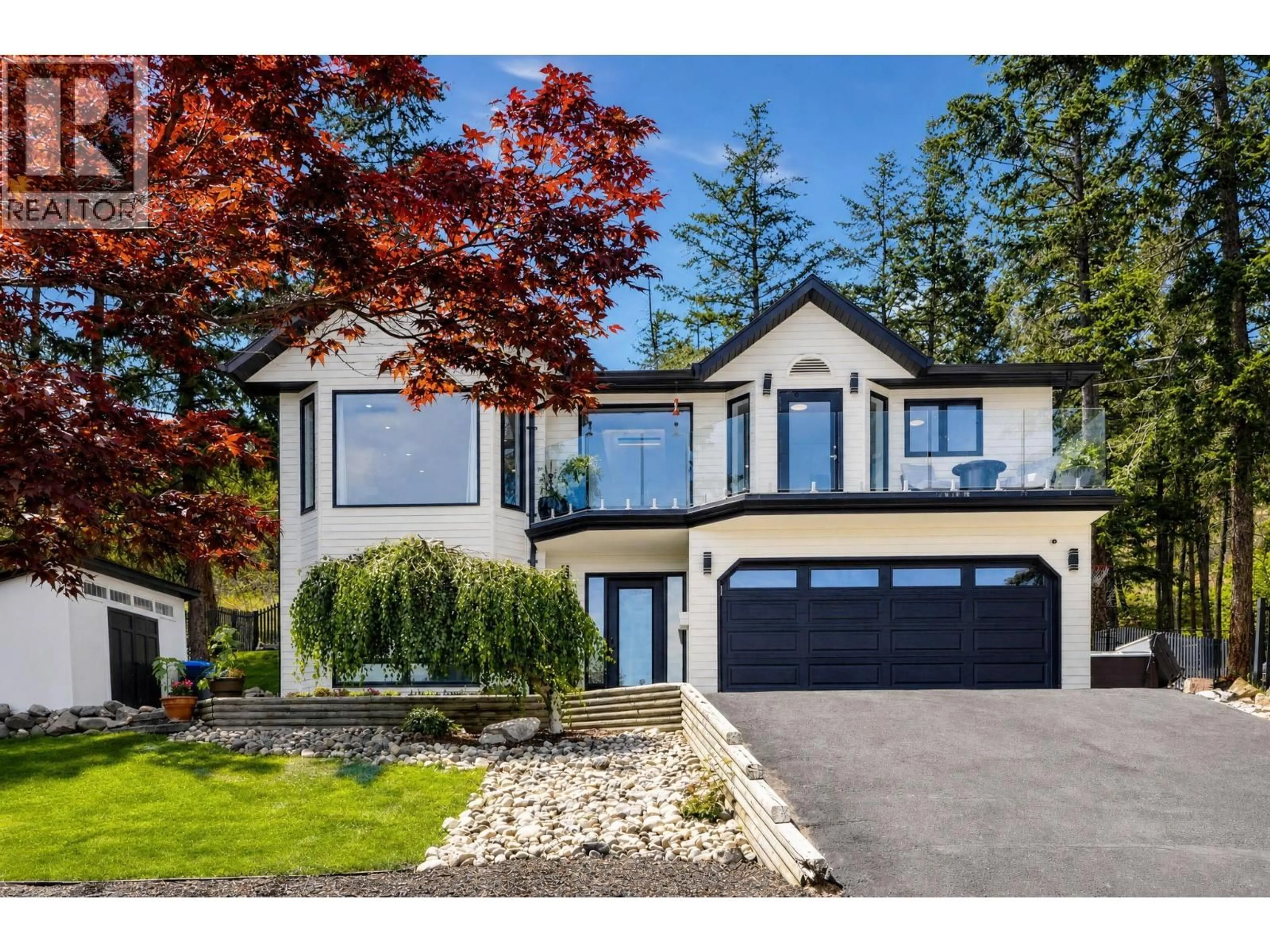 Home with vinyl exterior material, street for 1576 WEST KELOWNA ROAD, West Kelowna British Columbia V1Z3H5