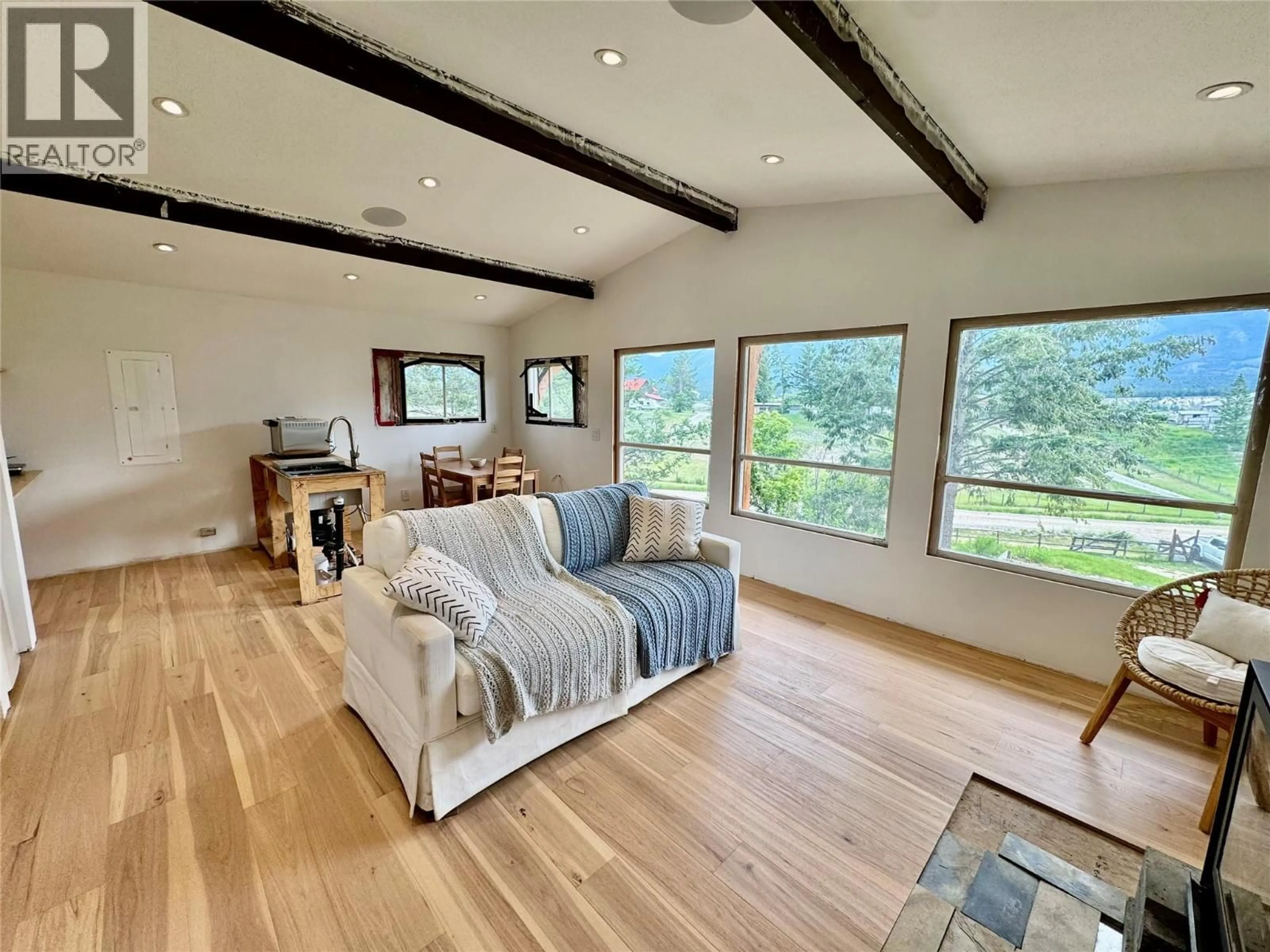Living room with furniture, wood/laminate floor for 4549 RUSHMERE ROAD, Windermere British Columbia V0A1K4