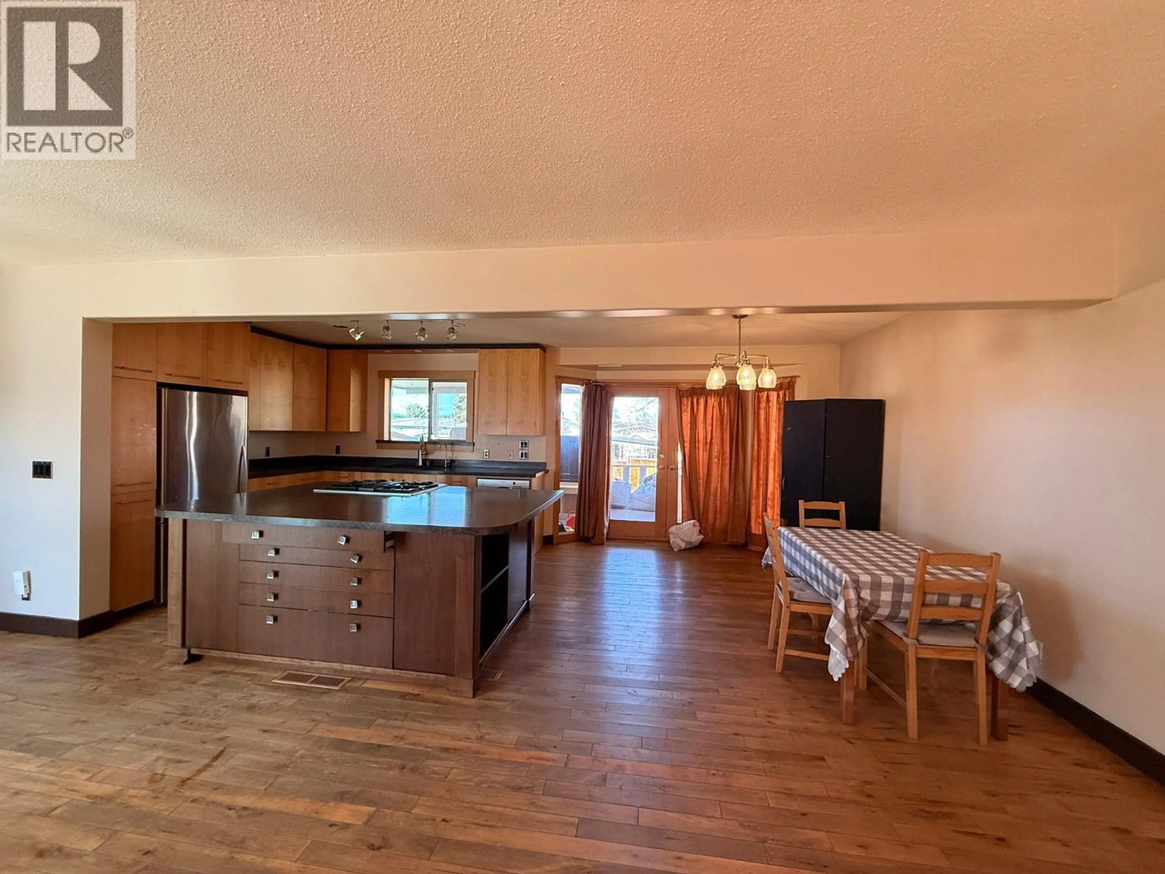 Open concept kitchen, wood/laminate floor for 460 MUGFORD ROAD, Kelowna British Columbia V1X2E7