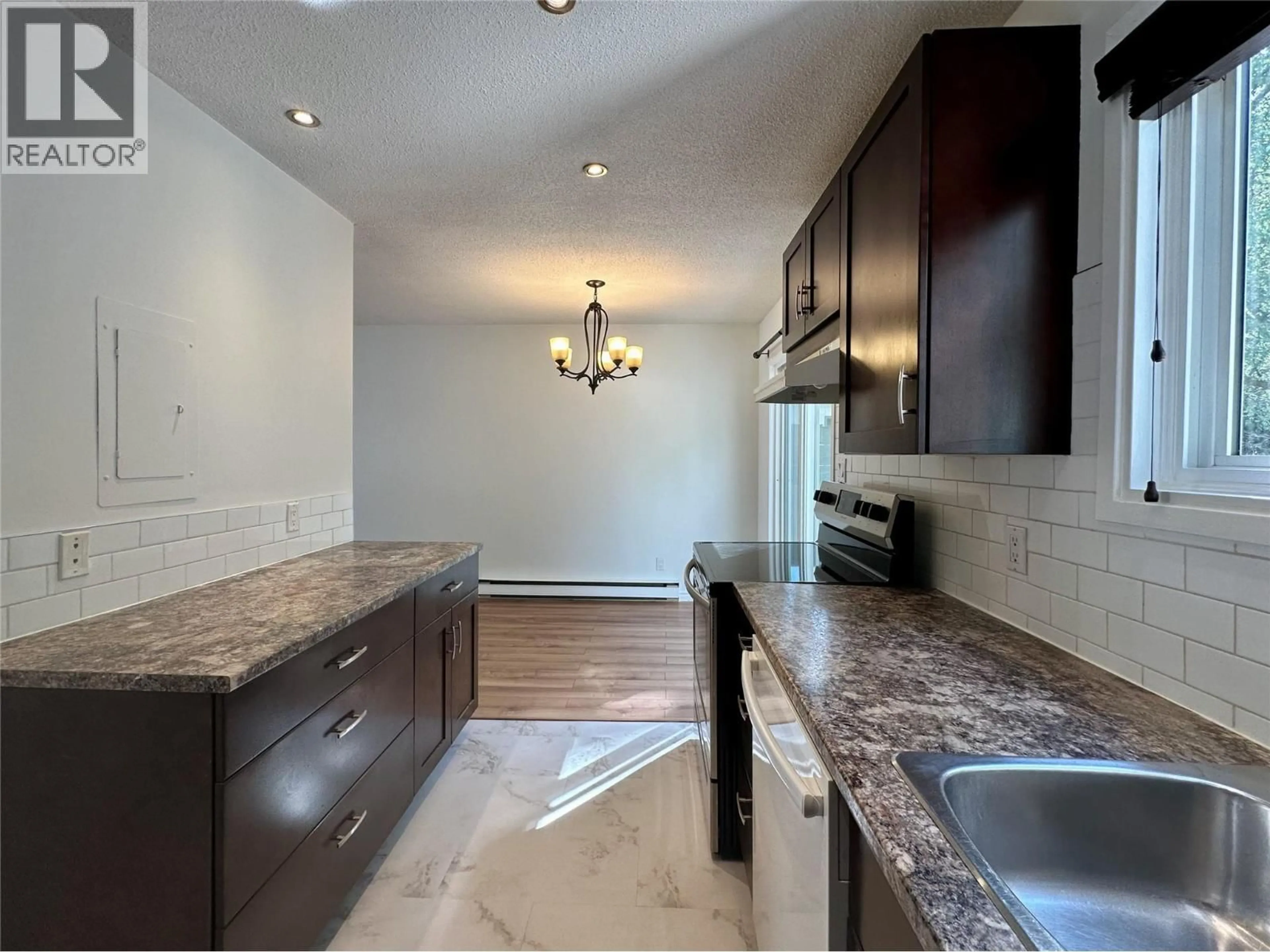 Open concept kitchen, ceramic/tile floor for 14 - 2310 36 STREET, Vernon British Columbia V1T6W2