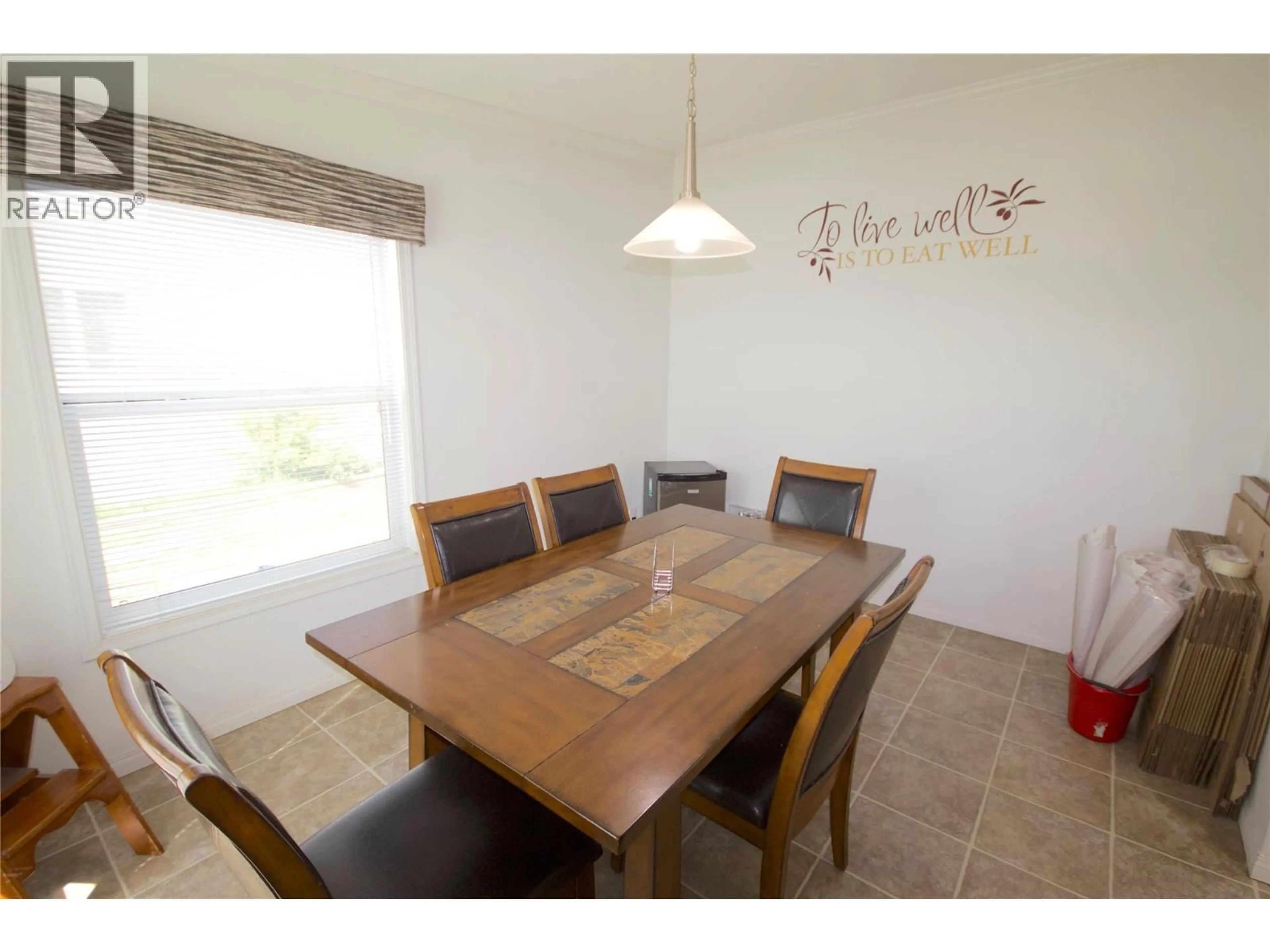 Dining room, wood/laminate floor for 8420 21 STREET, Dawson Creek British Columbia V1G0G7