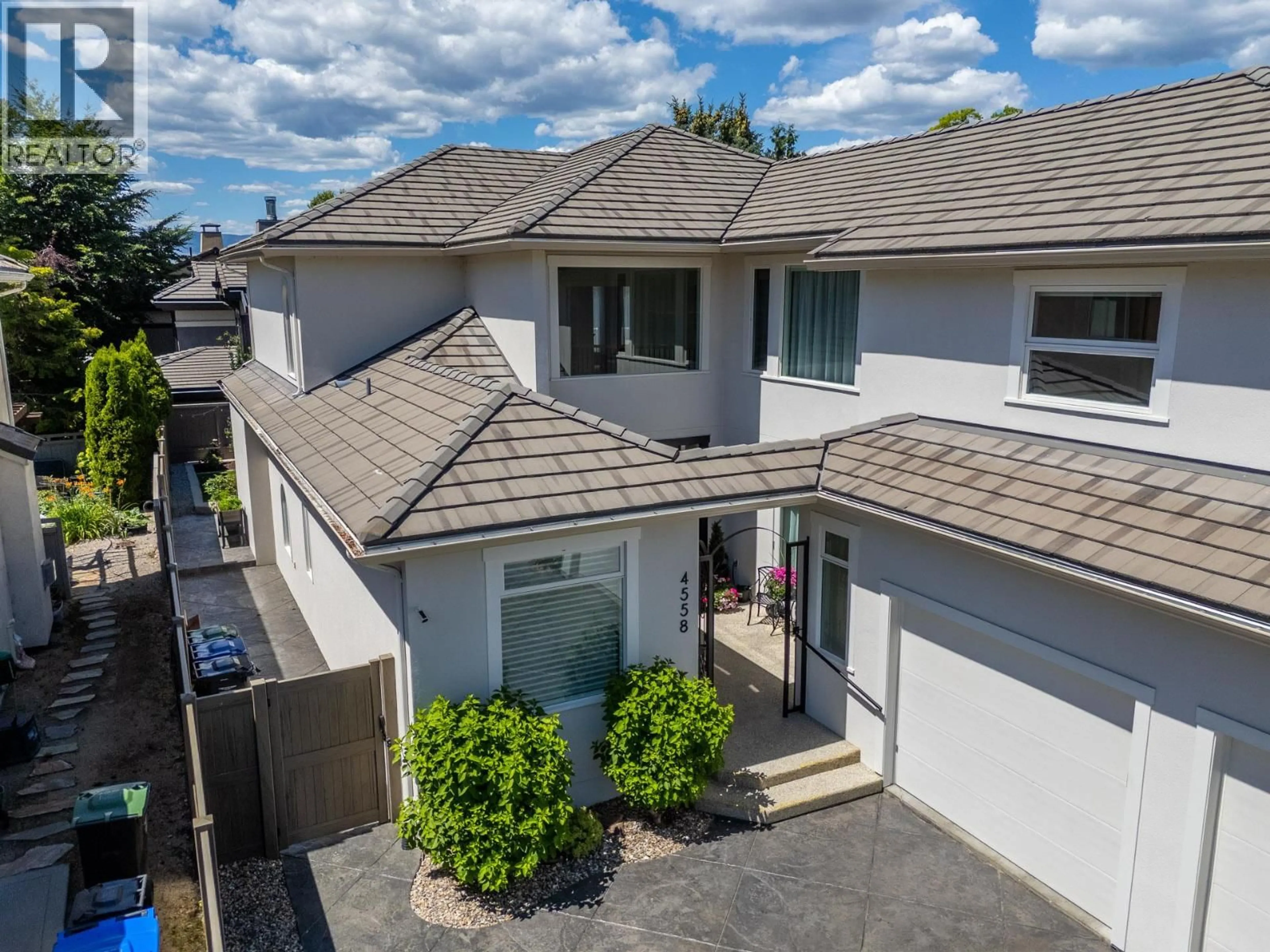 A pic from outside/outdoor area/front of a property/back of a property/a pic from drone, street for 4558 WALKER ROAD, Kelowna British Columbia V1W3C7