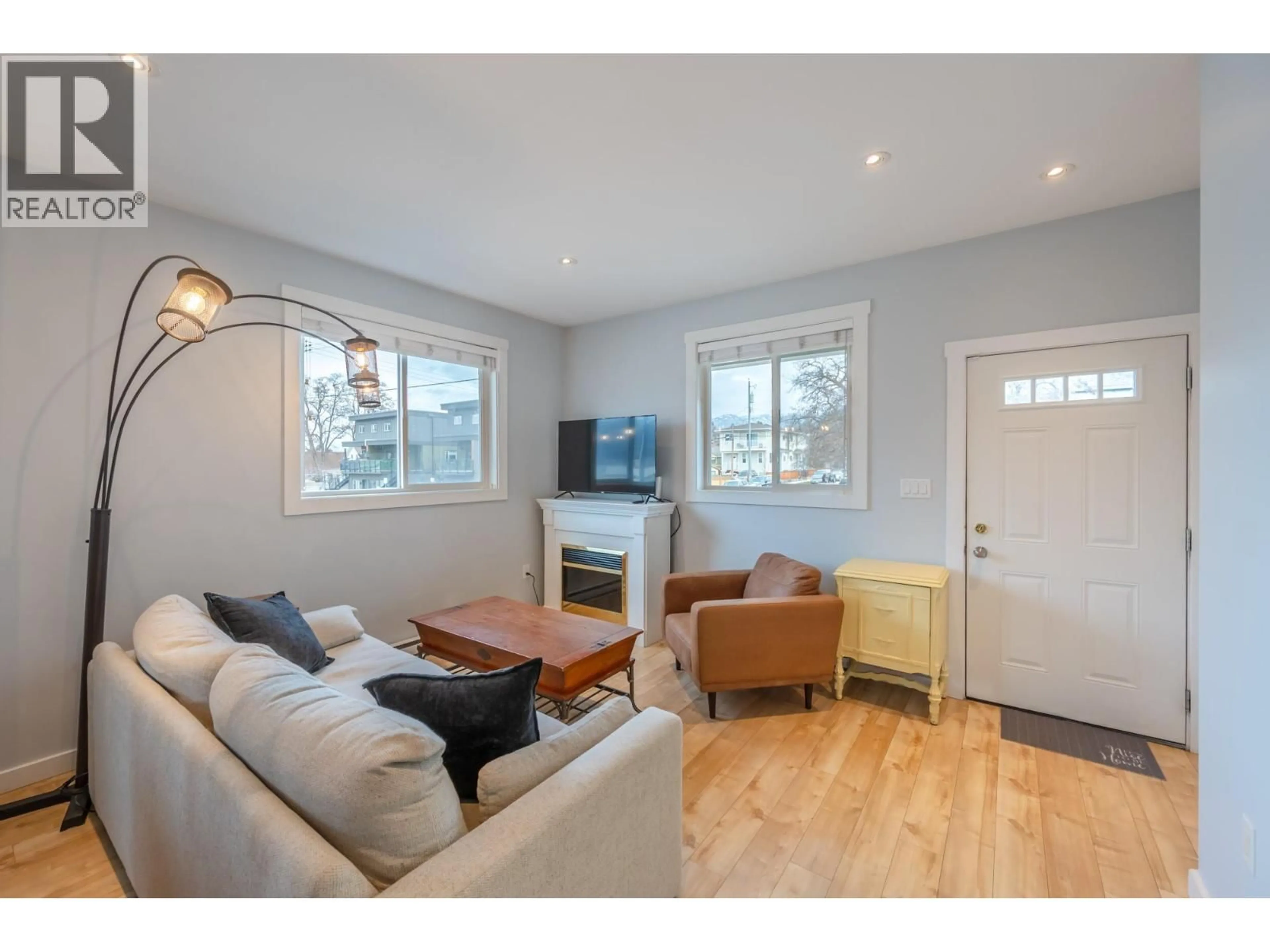 Living room with furniture, wood/laminate floor for 101 - 601 ELLIS STREET, Penticton British Columbia V2A4M5