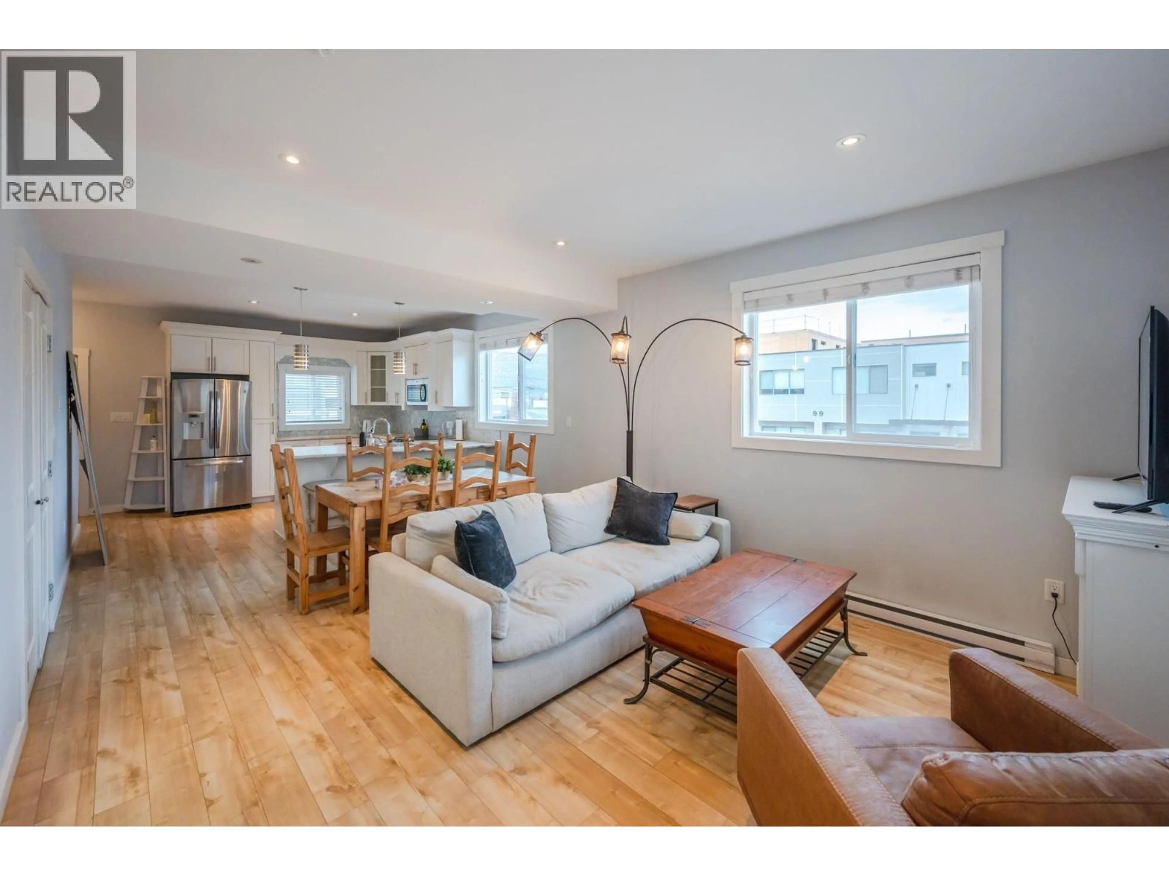 Living room with furniture, wood/laminate floor for 101 - 601 ELLIS STREET, Penticton British Columbia V2A4M5
