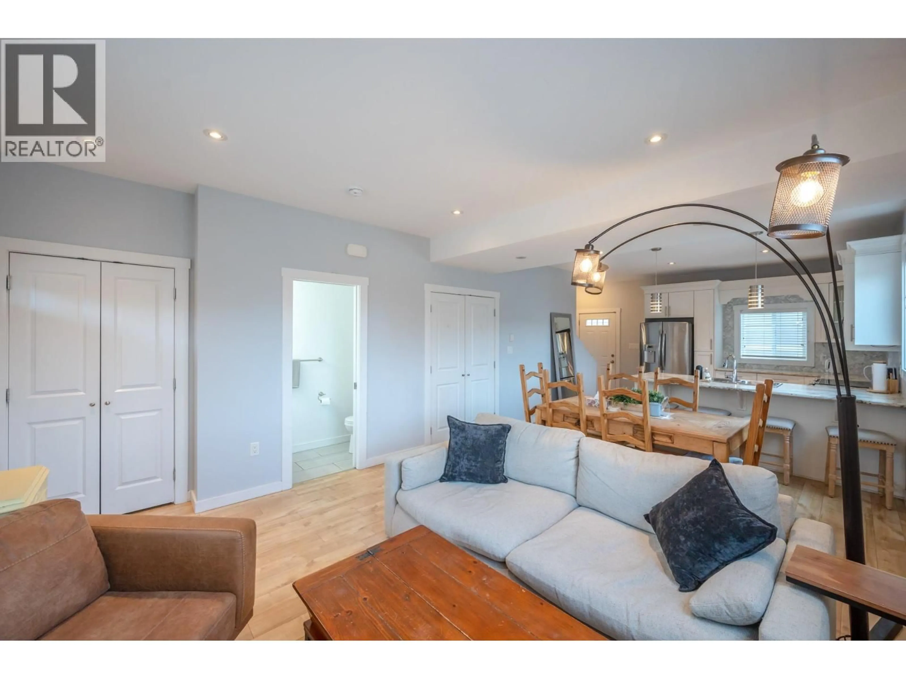 Living room with furniture, wood/laminate floor for 101 - 601 ELLIS STREET, Penticton British Columbia V2A4M5